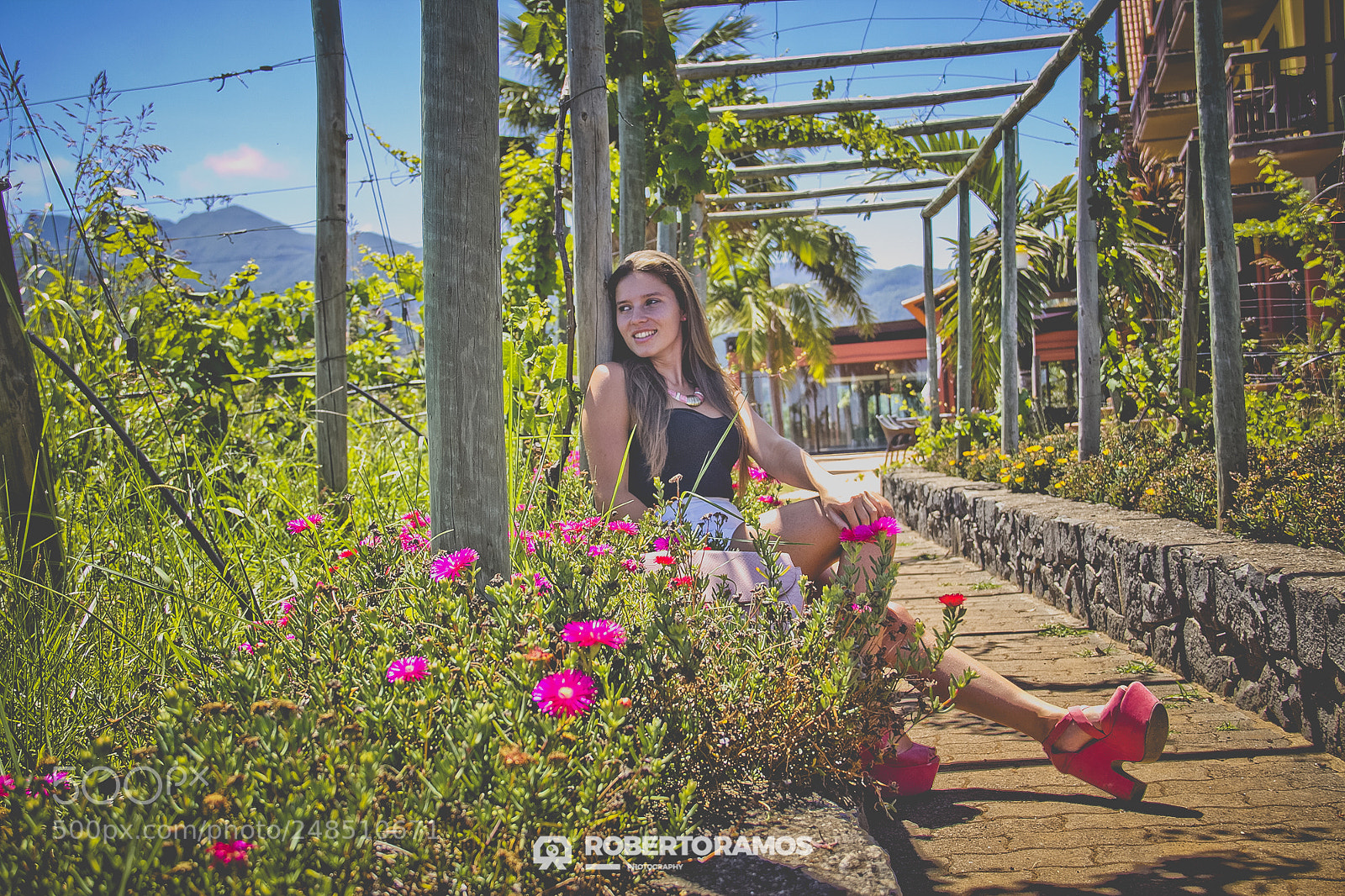 Canon EOS 60D sample photo. A smile between flowers photography