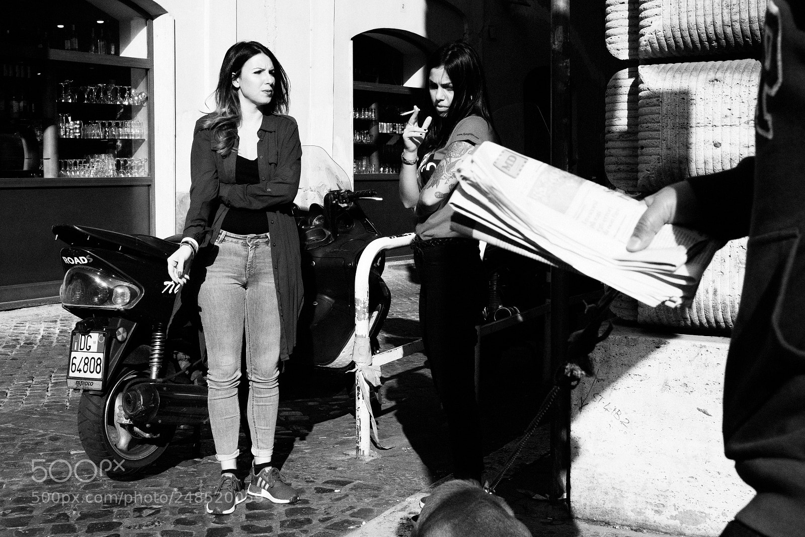 Sony a6500 sample photo. Women smoking, hand newspaper photography