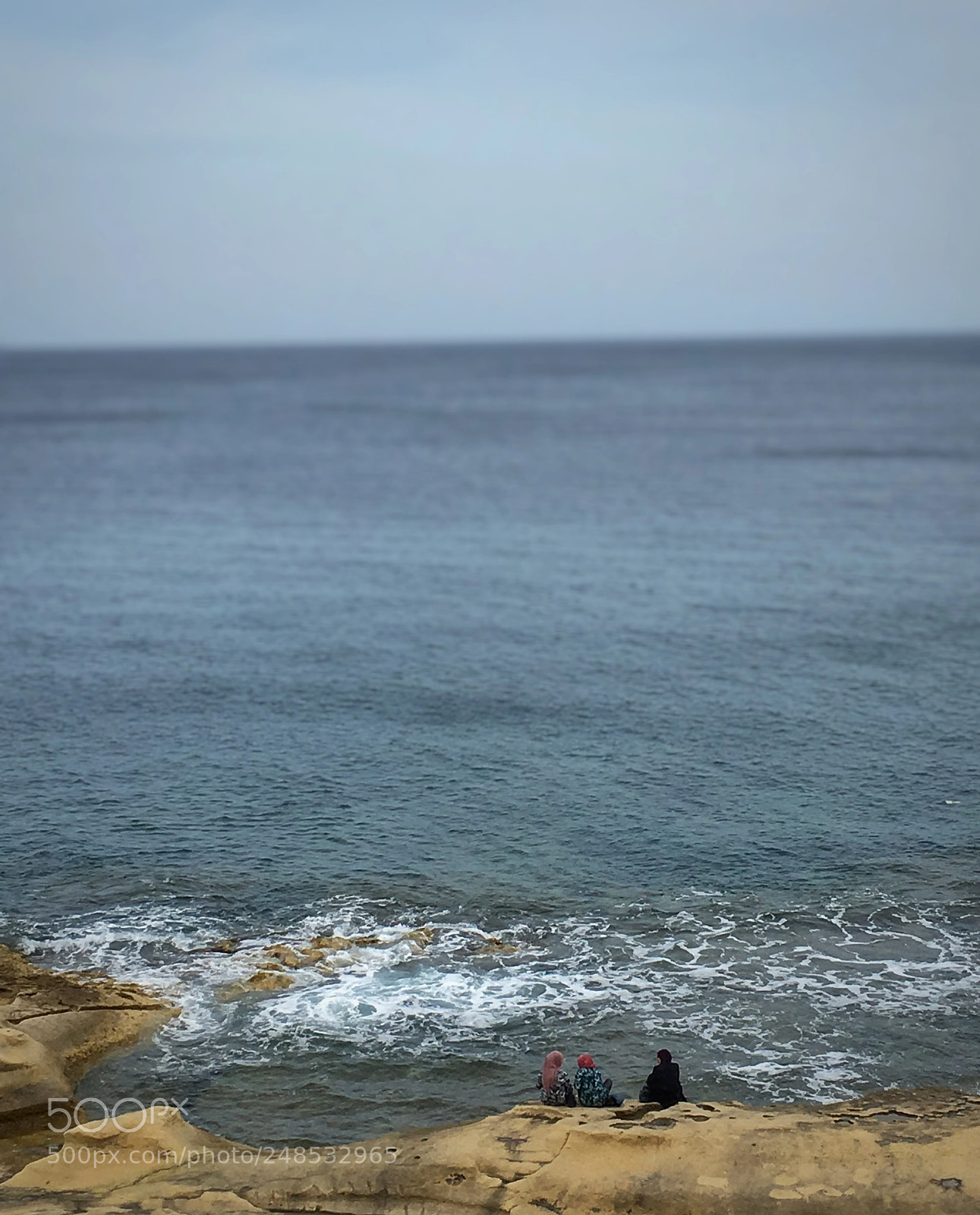 Apple iPhone 6s Plus sample photo. Woman sitting on seashore photography