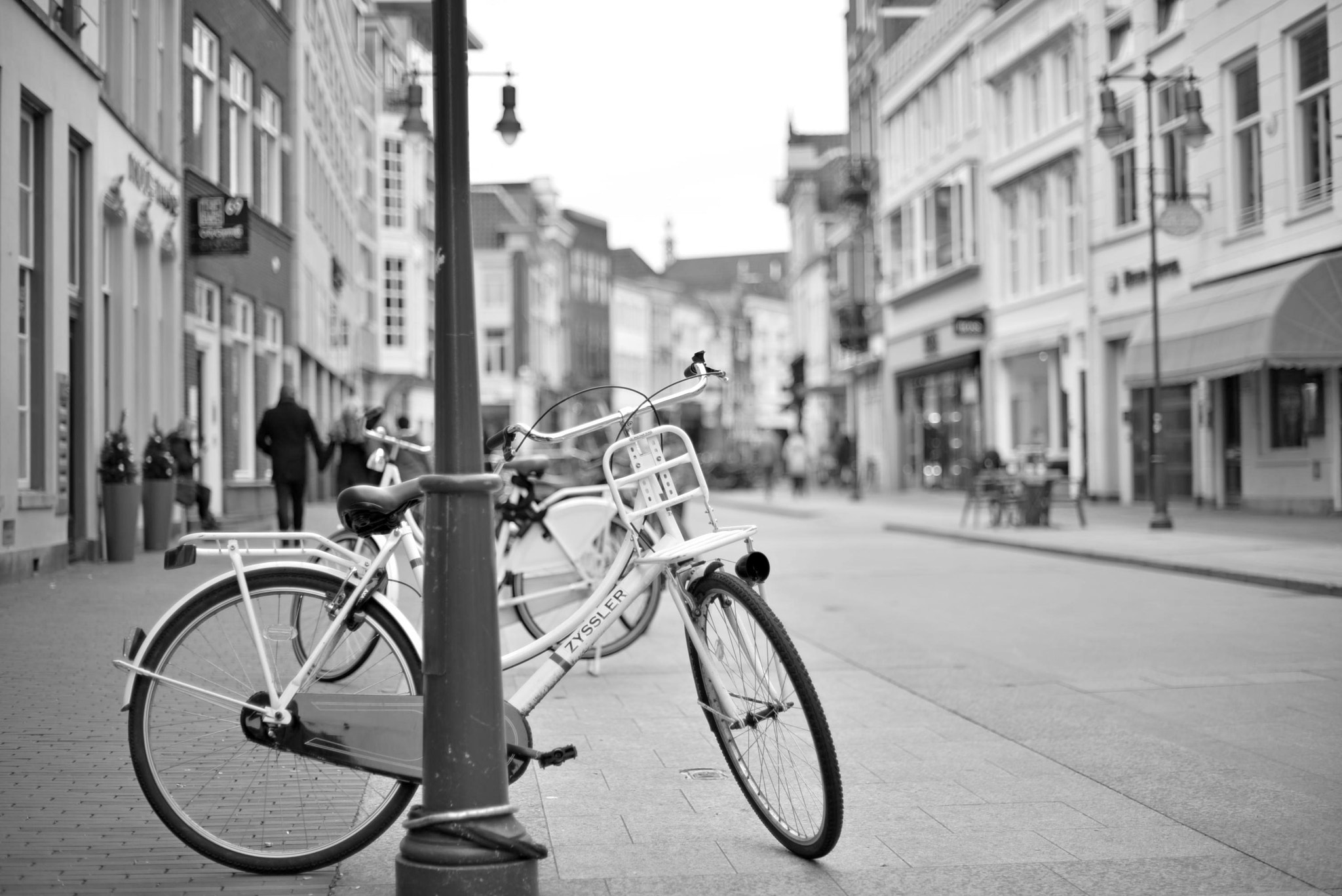 Nikon D610 sample photo. One of the dutch cozy streets during a weekend. bicycles, couples, old architecture... photography