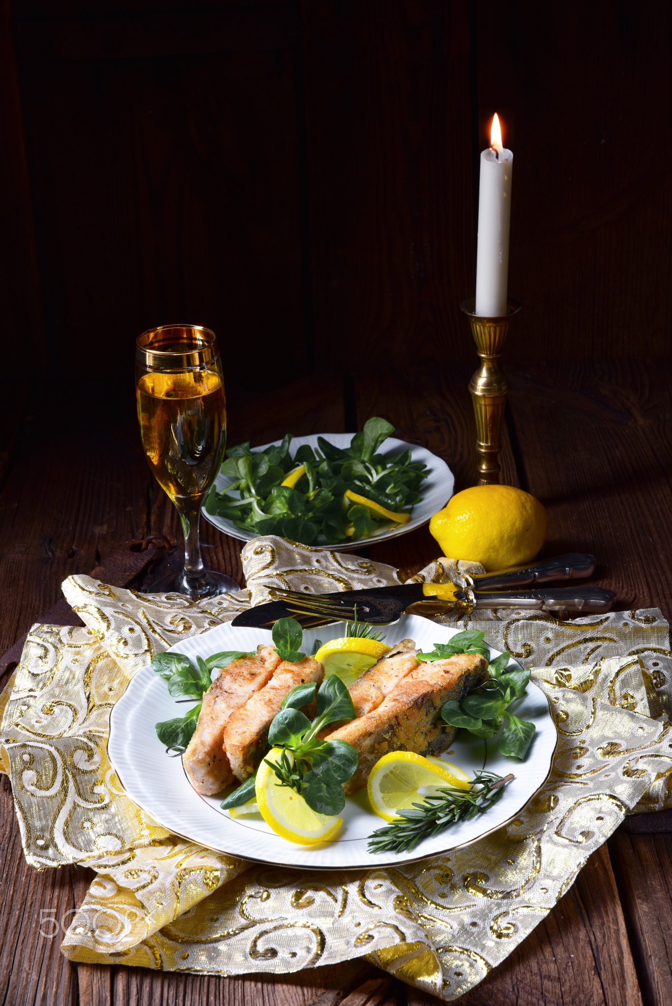 Fried carp fillet on wintry salad