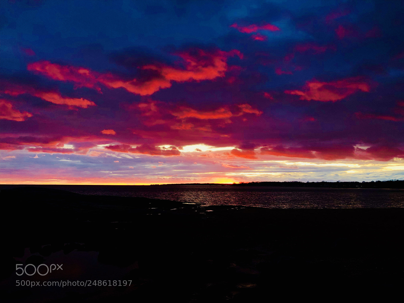 Apple iPhone X sample photo. Sunset under heavy clouds photography
