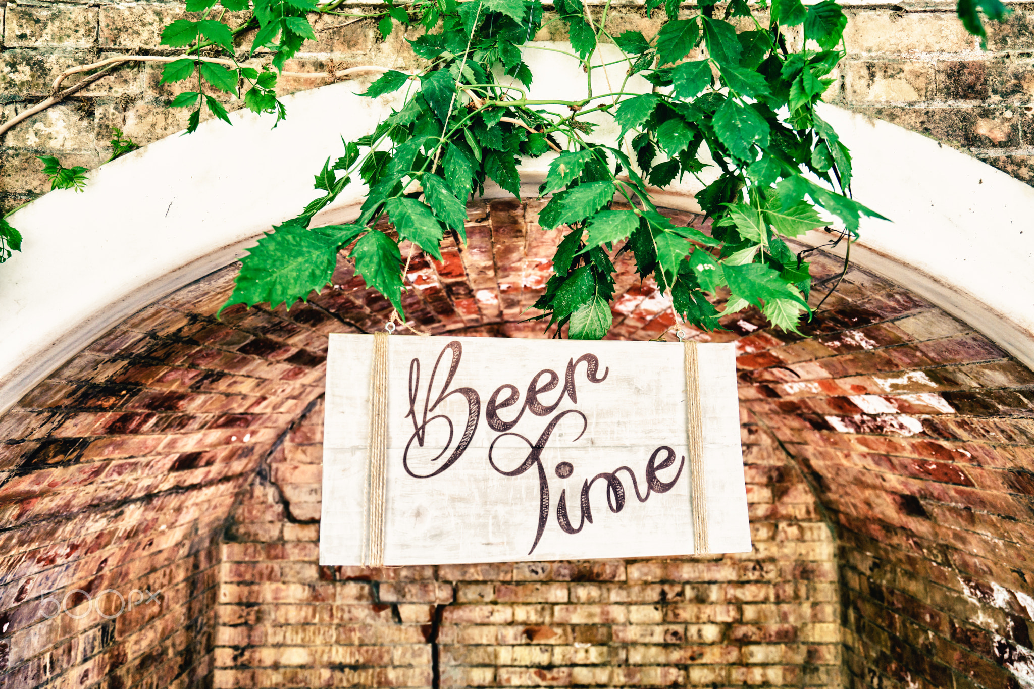 Beer time signboard in arch