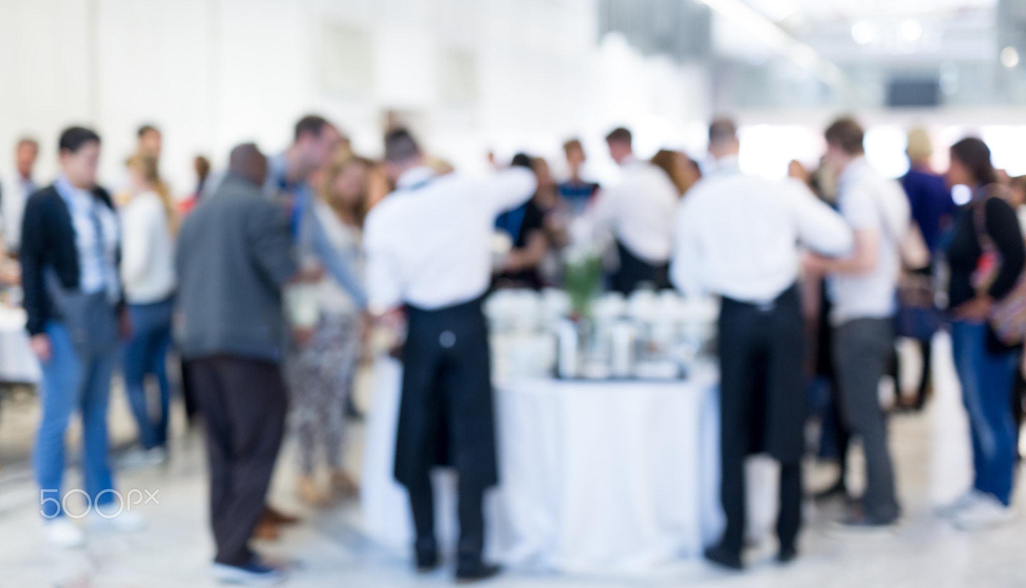 Blured image of businesspeople at coffee break at conference meeting.