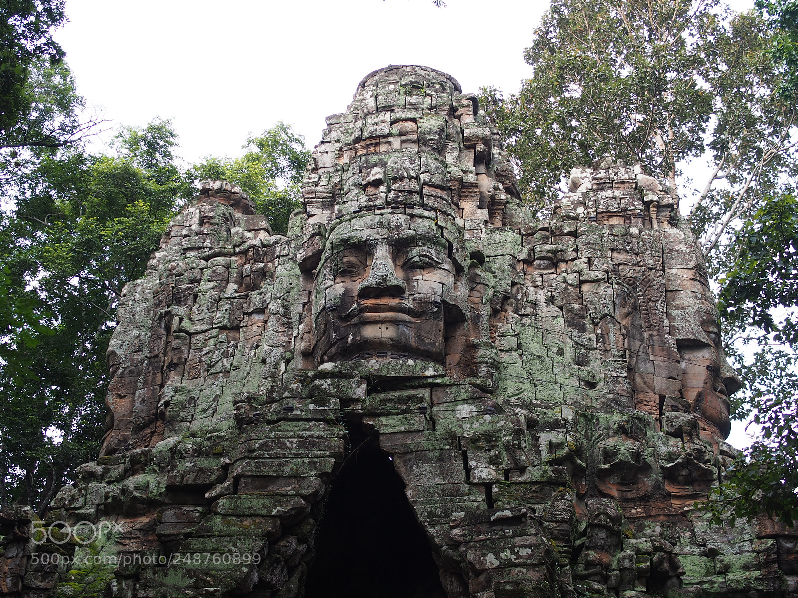 Olympus PEN E-PL5 sample photo. Stone faces in archway photography