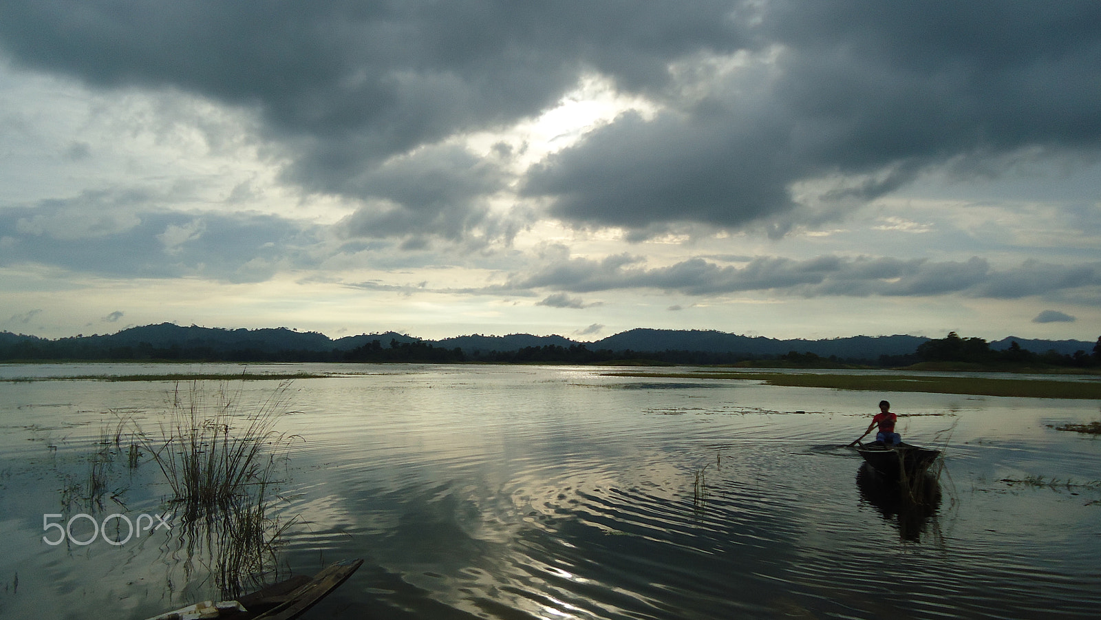 Sony Cyber-shot DSC-W320 sample photo. A man is fishing on the boat. photography