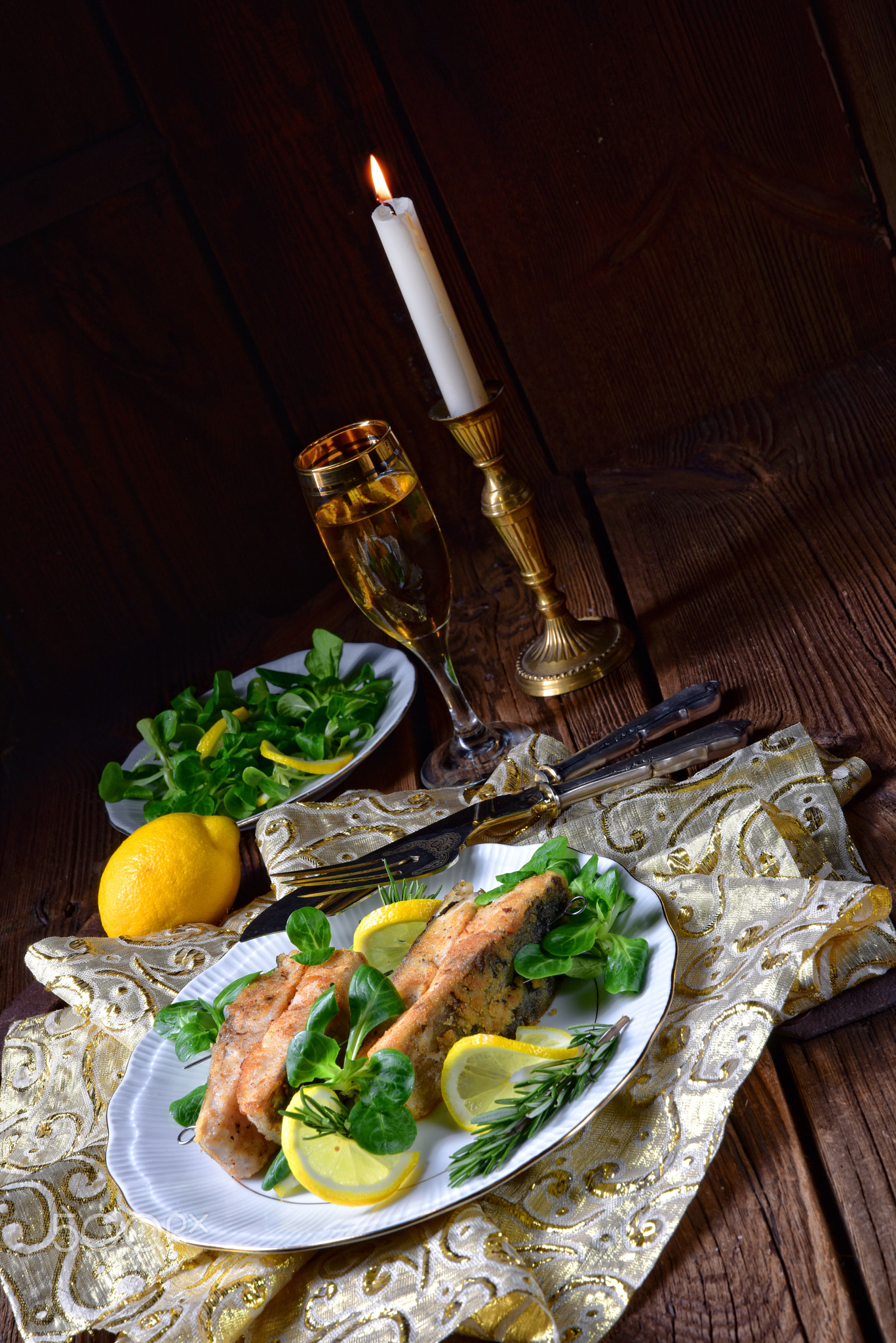 Fried carp fillet on wintry salad