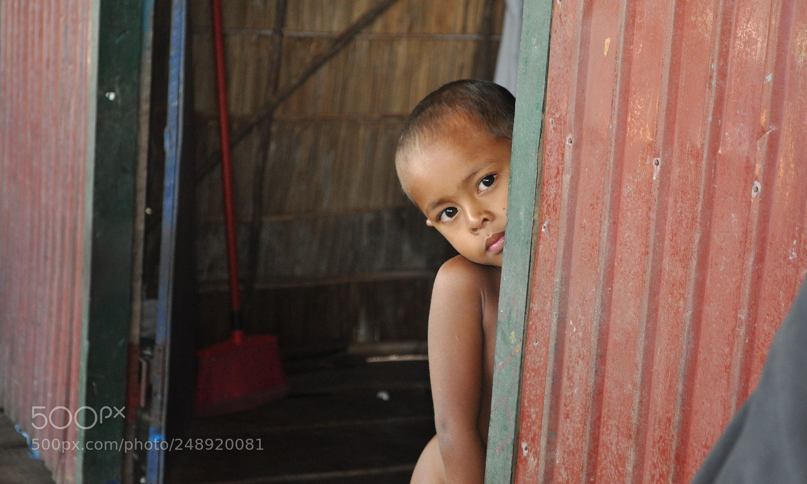 Nikon D5000 sample photo. Cambodian boy floating village photography