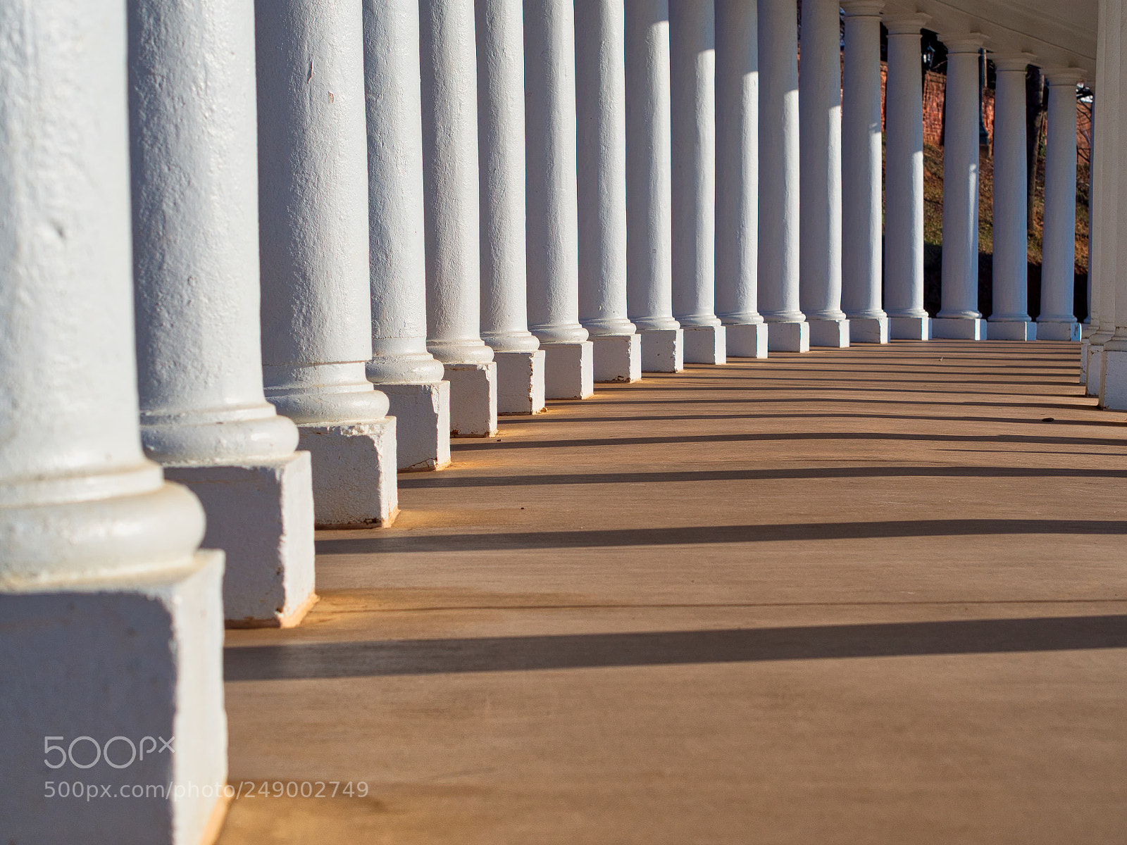 Olympus OM-D E-M10 sample photo. Colonnade shadows photography