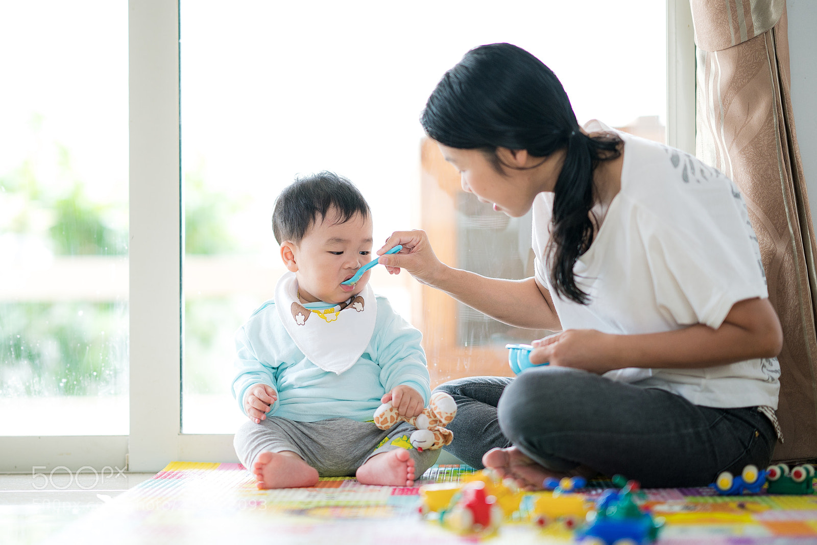 Sony a7R II sample photo. Mothe feed a baby photography