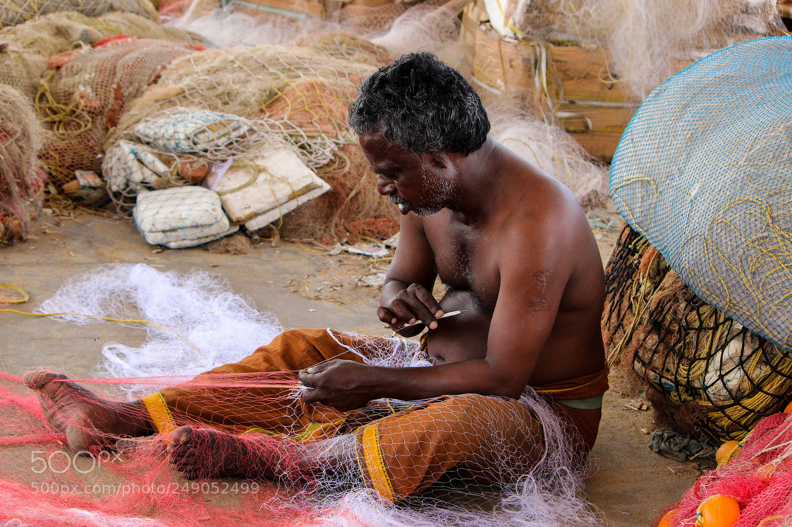 Canon EOS 600D (Rebel EOS T3i / EOS Kiss X5) sample photo. Fisherman sewing his net photography