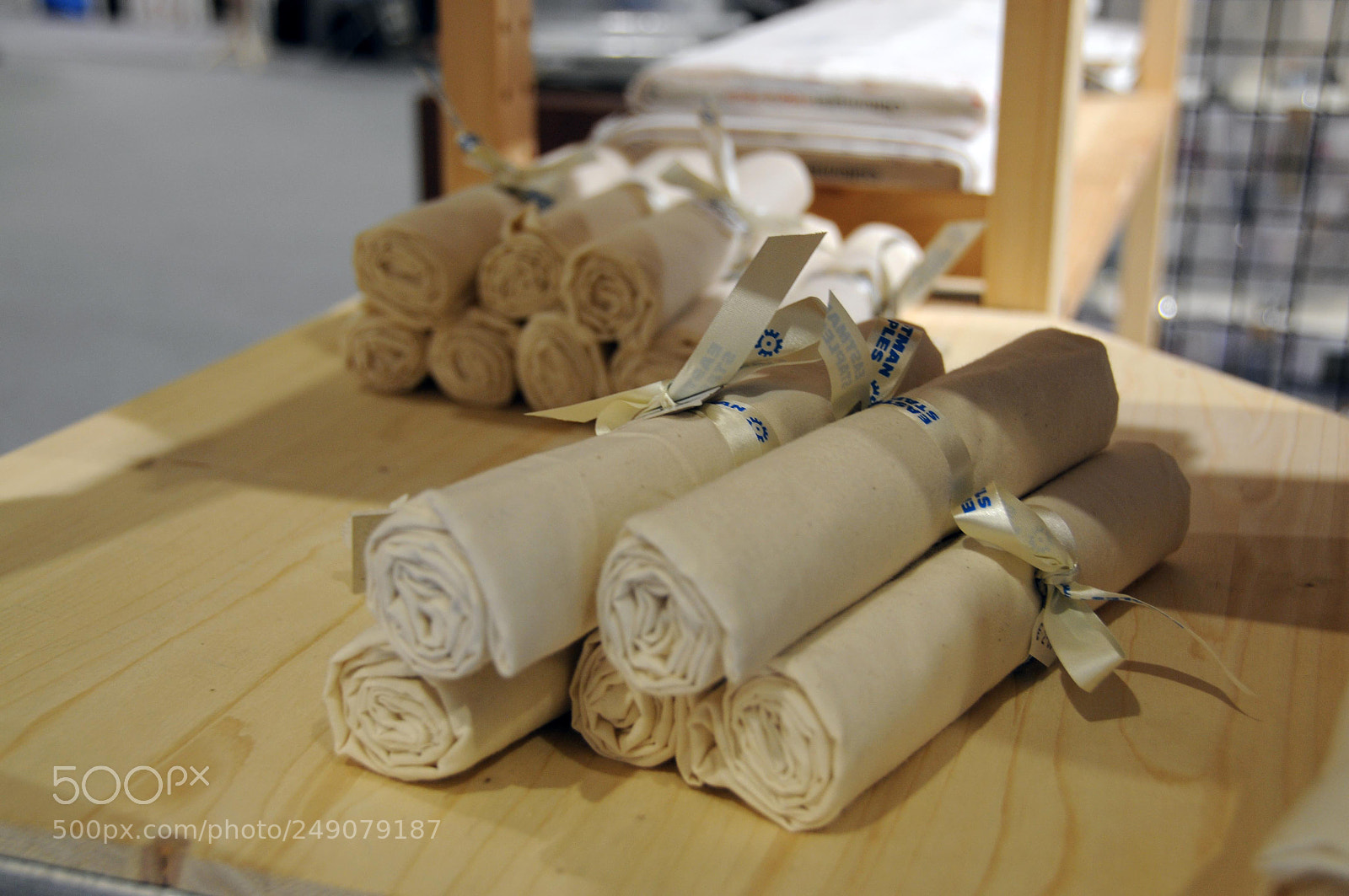 Nikon D300 sample photo. Beige fabric rolls photography