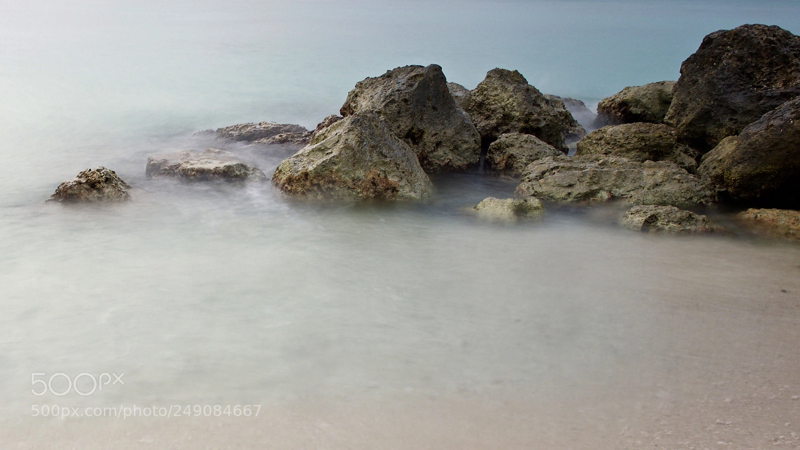 Olympus OM-D E-M1 Mark II sample photo. Rocks at the beach photography