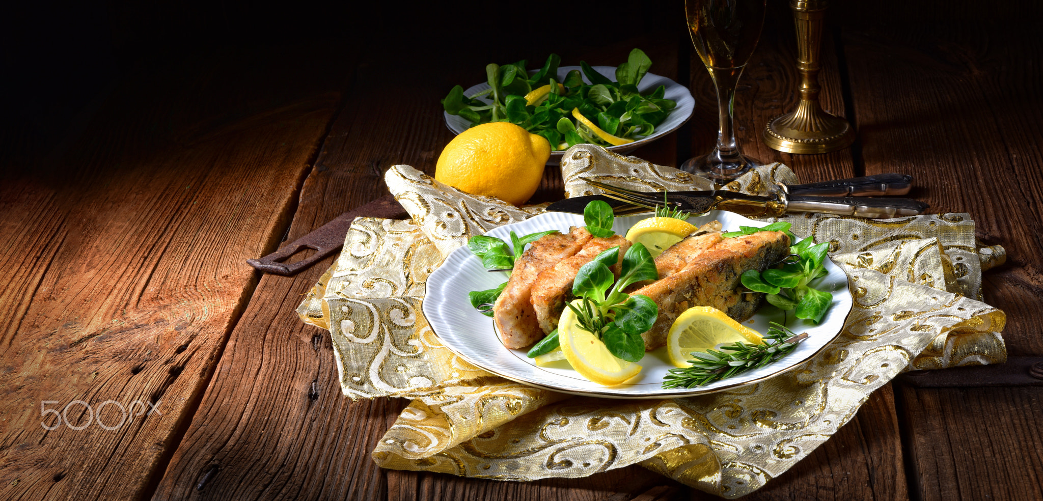 Fried carp fillet on wintry salad