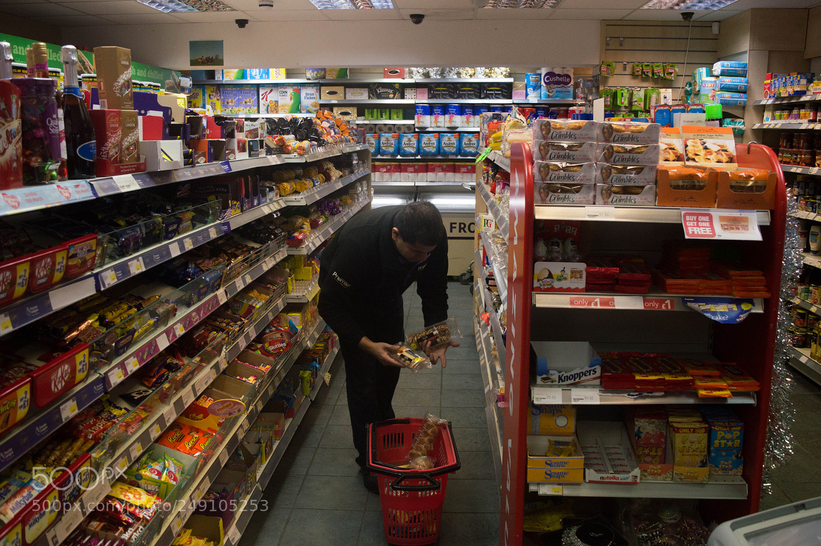 Nikon D3200 sample photo. Stocking shelves photography