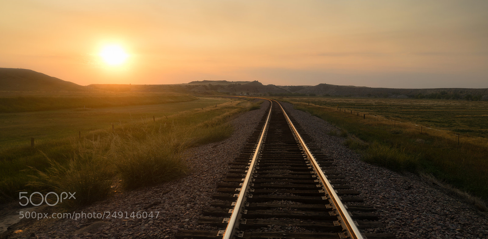 Sony a7 sample photo. Railroad tracks reflect sunrise photography