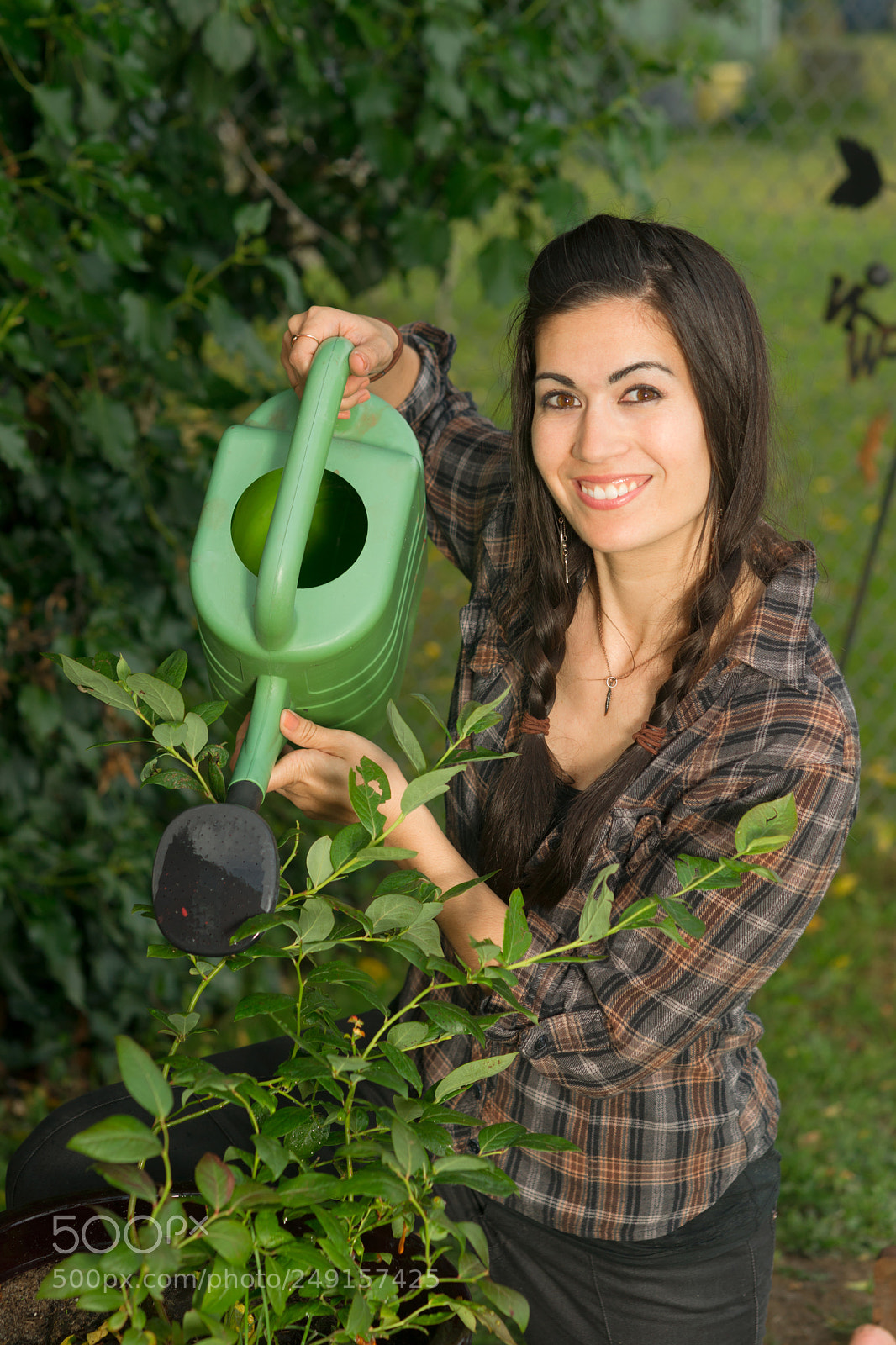 Sony Alpha DSLR-A850 sample photo. Portrait woman watering plant photography