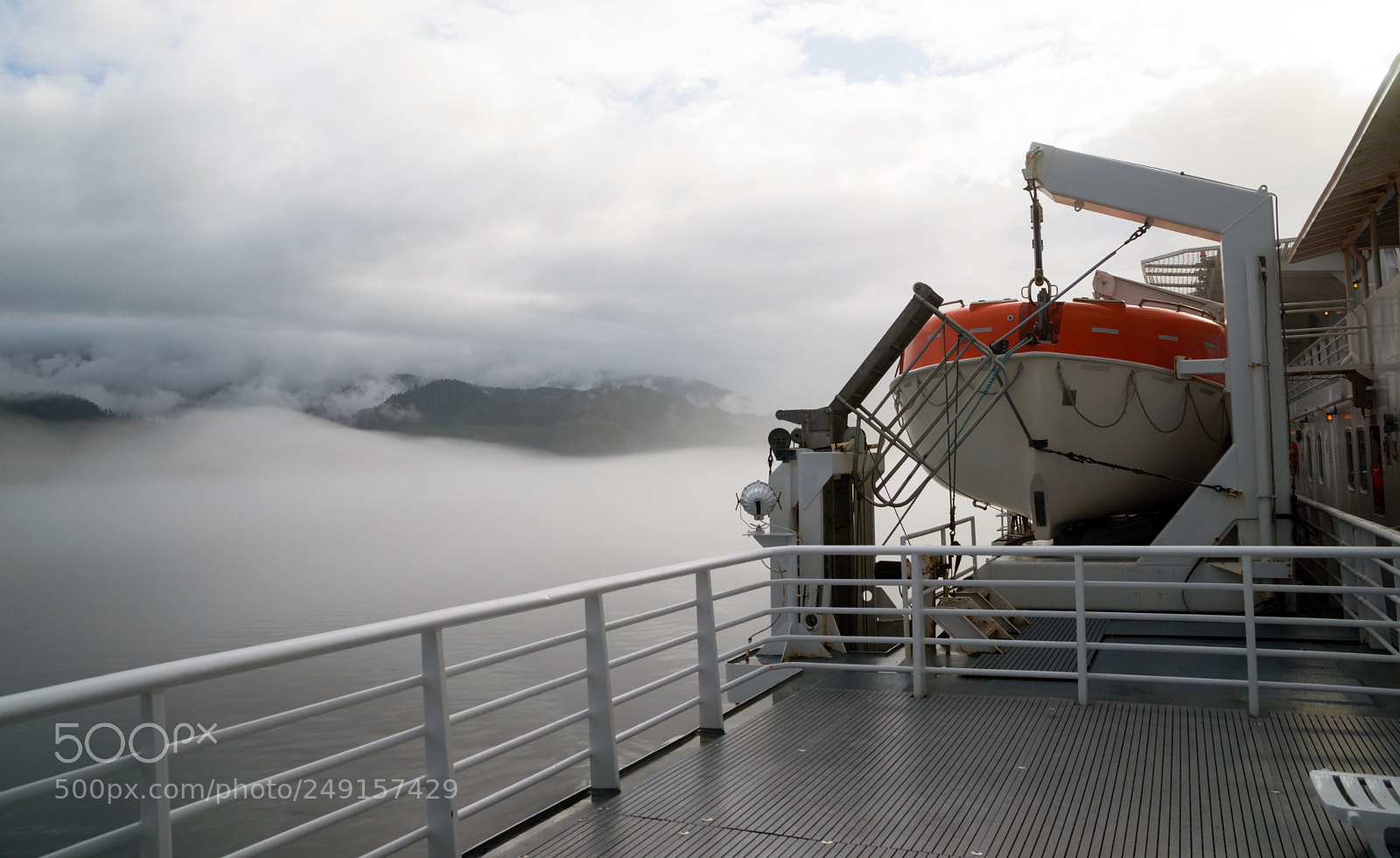 Sony Alpha DSLR-A850 sample photo. Orange lifeboat inside passage photography