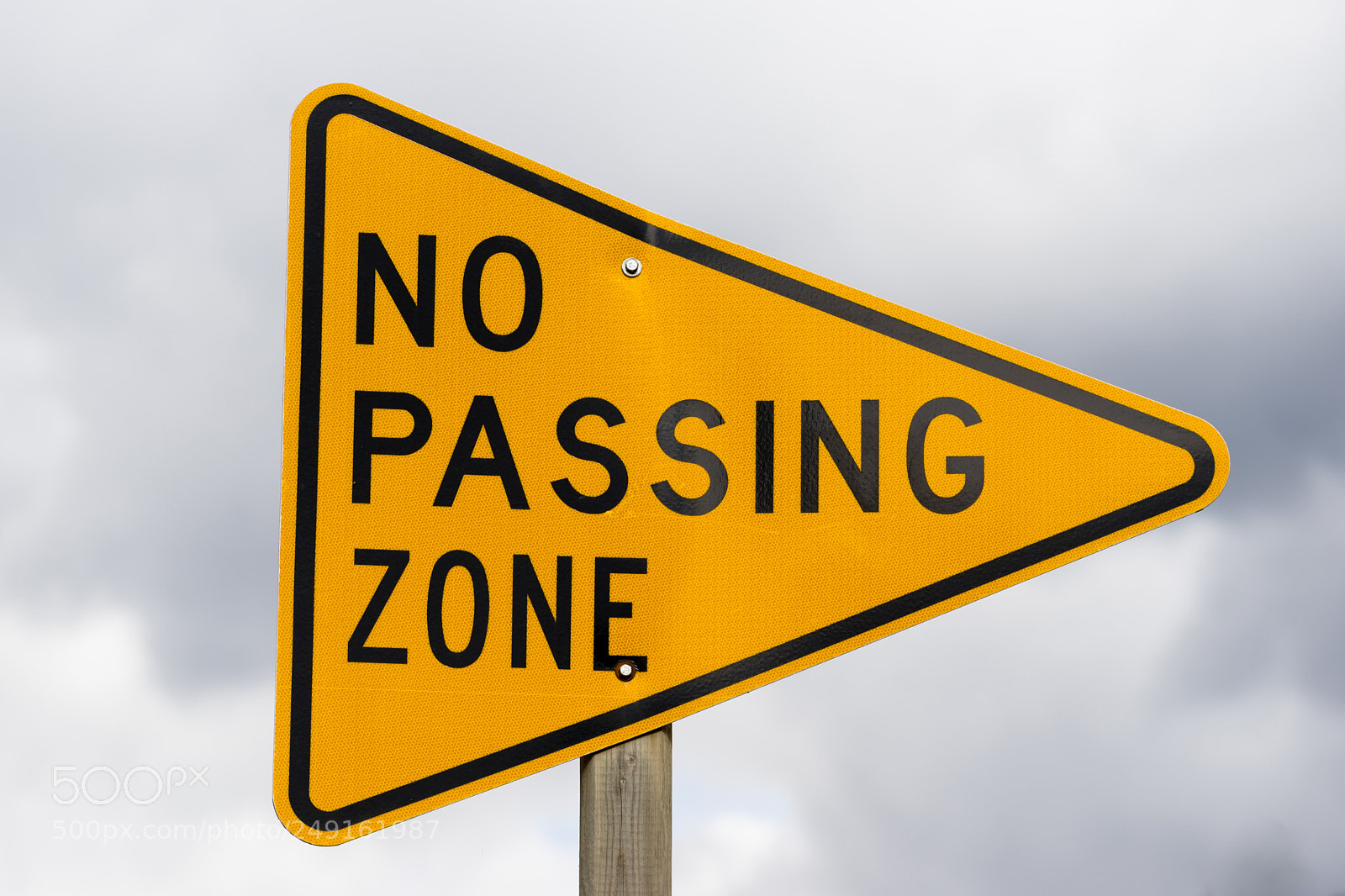 Sony a7 sample photo. Yellow triangle road sign photography