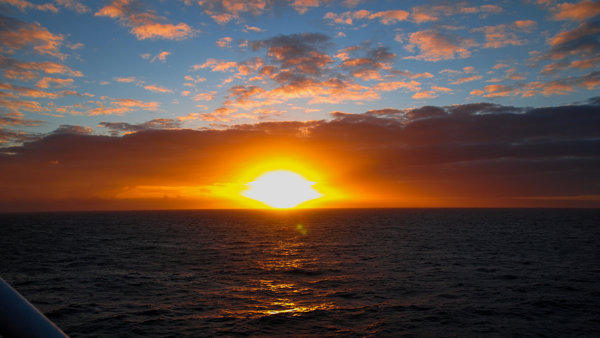 Olympus PEN E-P1 sample photo. Orange sun over the sea photography