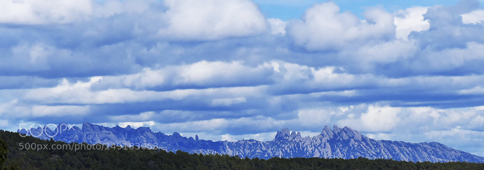 Panasonic Lumix DMC-FZ200 sample photo. Clouds over montserrat photography