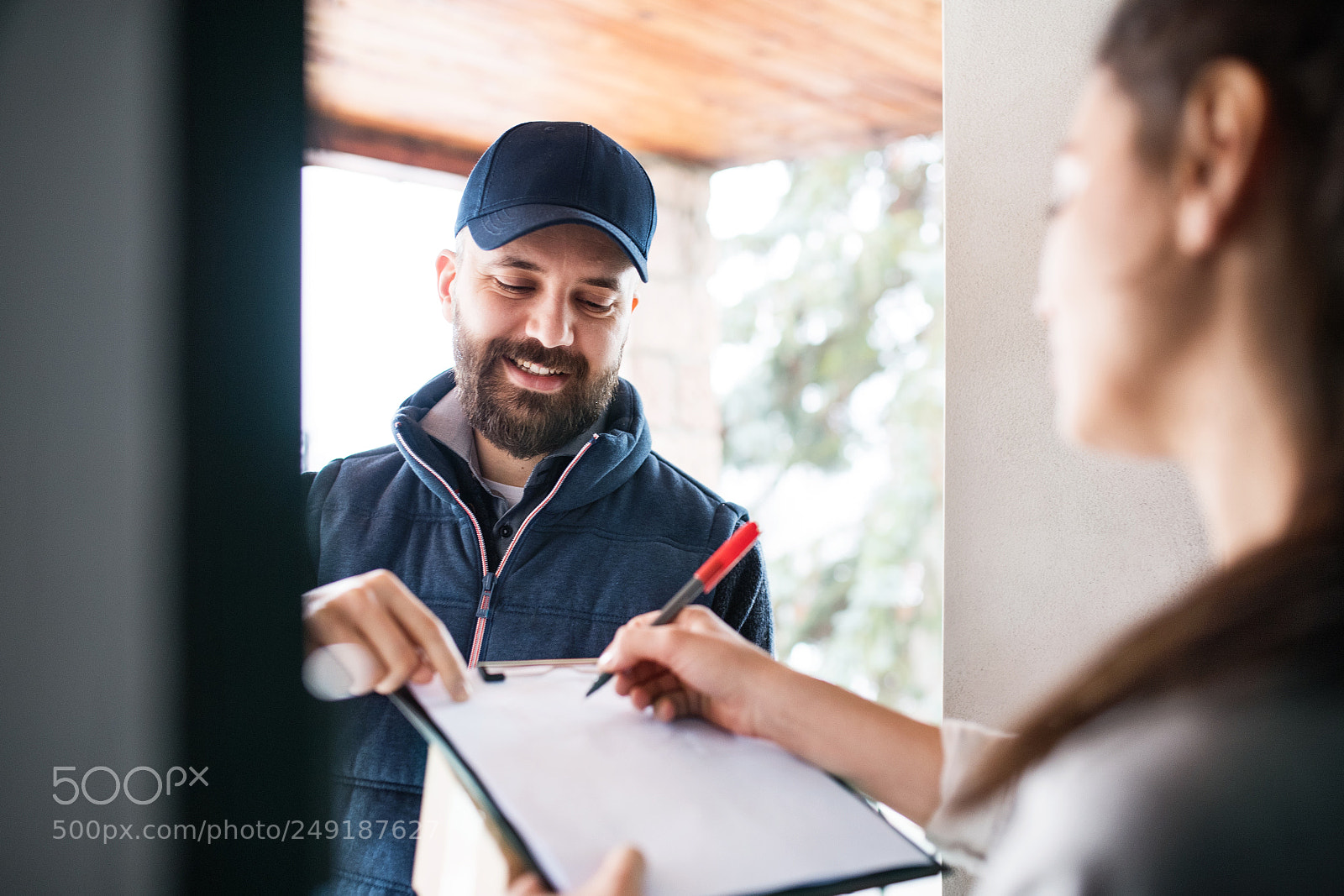 Nikon D5 sample photo. Woman receiving parcel from photography