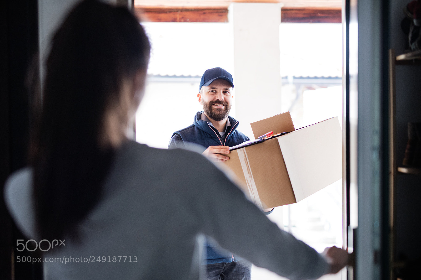 Nikon D5 sample photo. Woman receiving parcel from photography