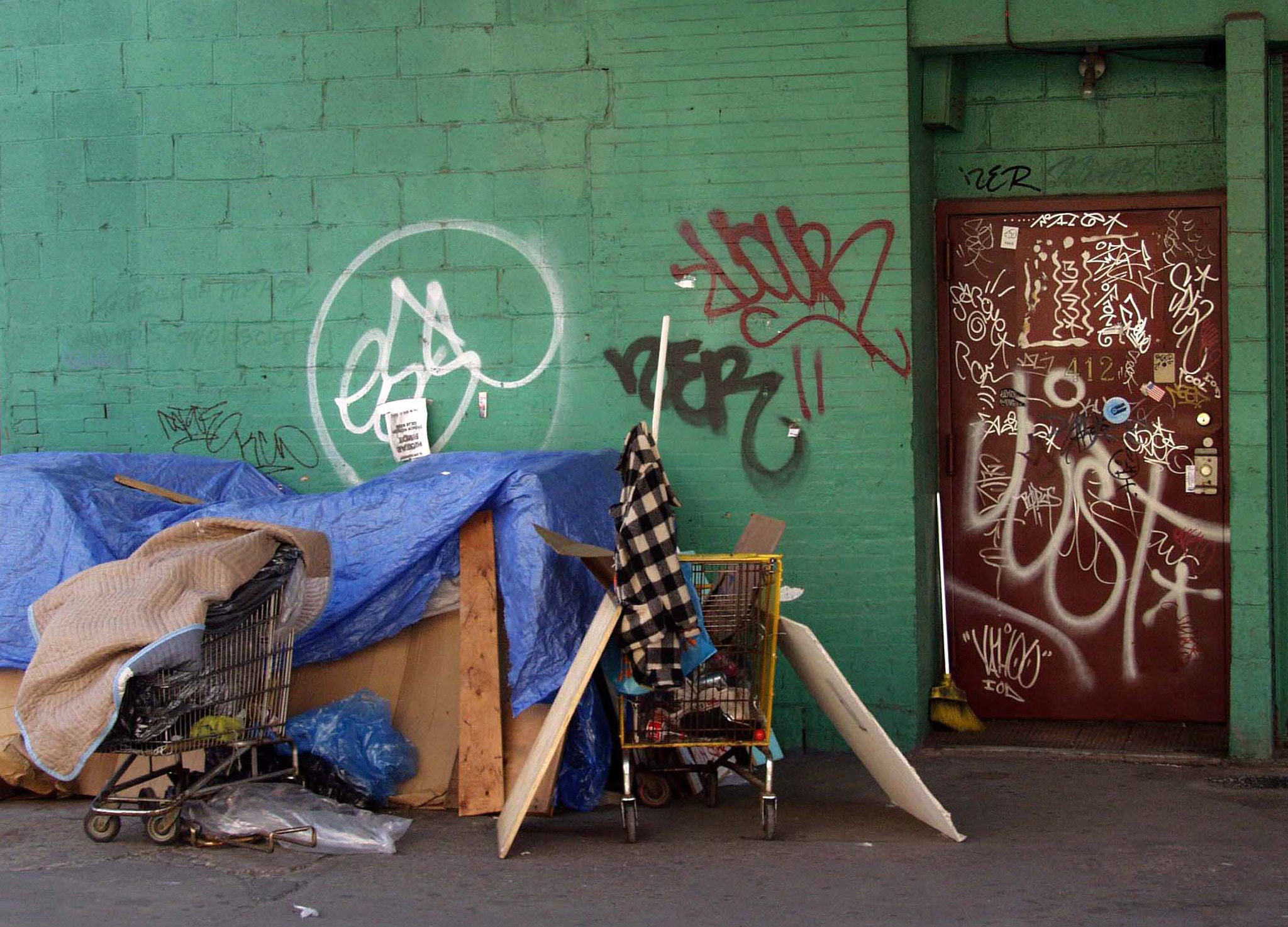 Olympus E-10 sample photo. Sidewak shelter, nyc  2002 photography