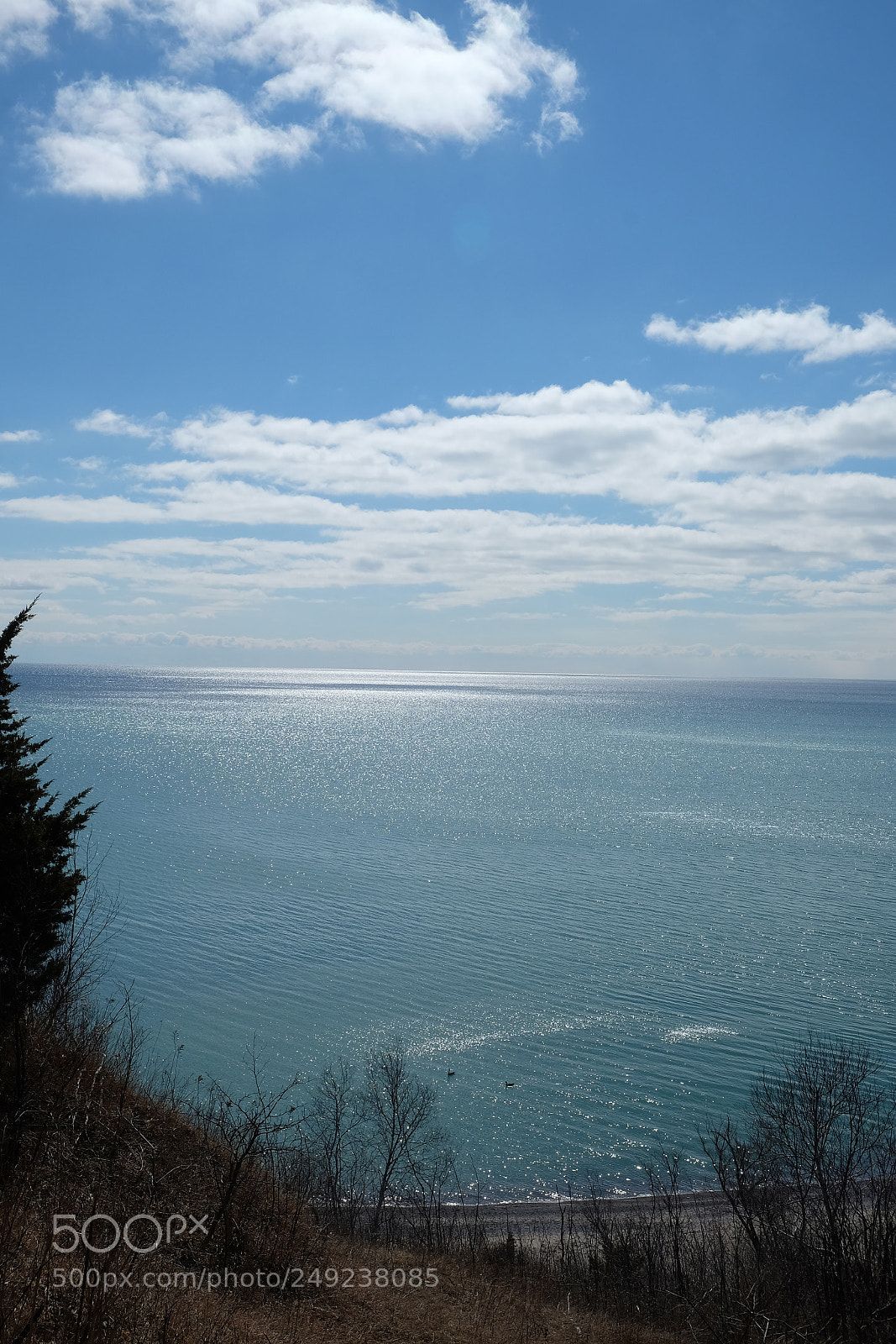 Fujifilm X-T10 sample photo. Sunbeams on the water photography
