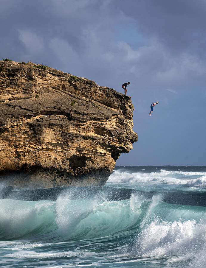 Sony a7R II sample photo. Man jumpimg into water photography