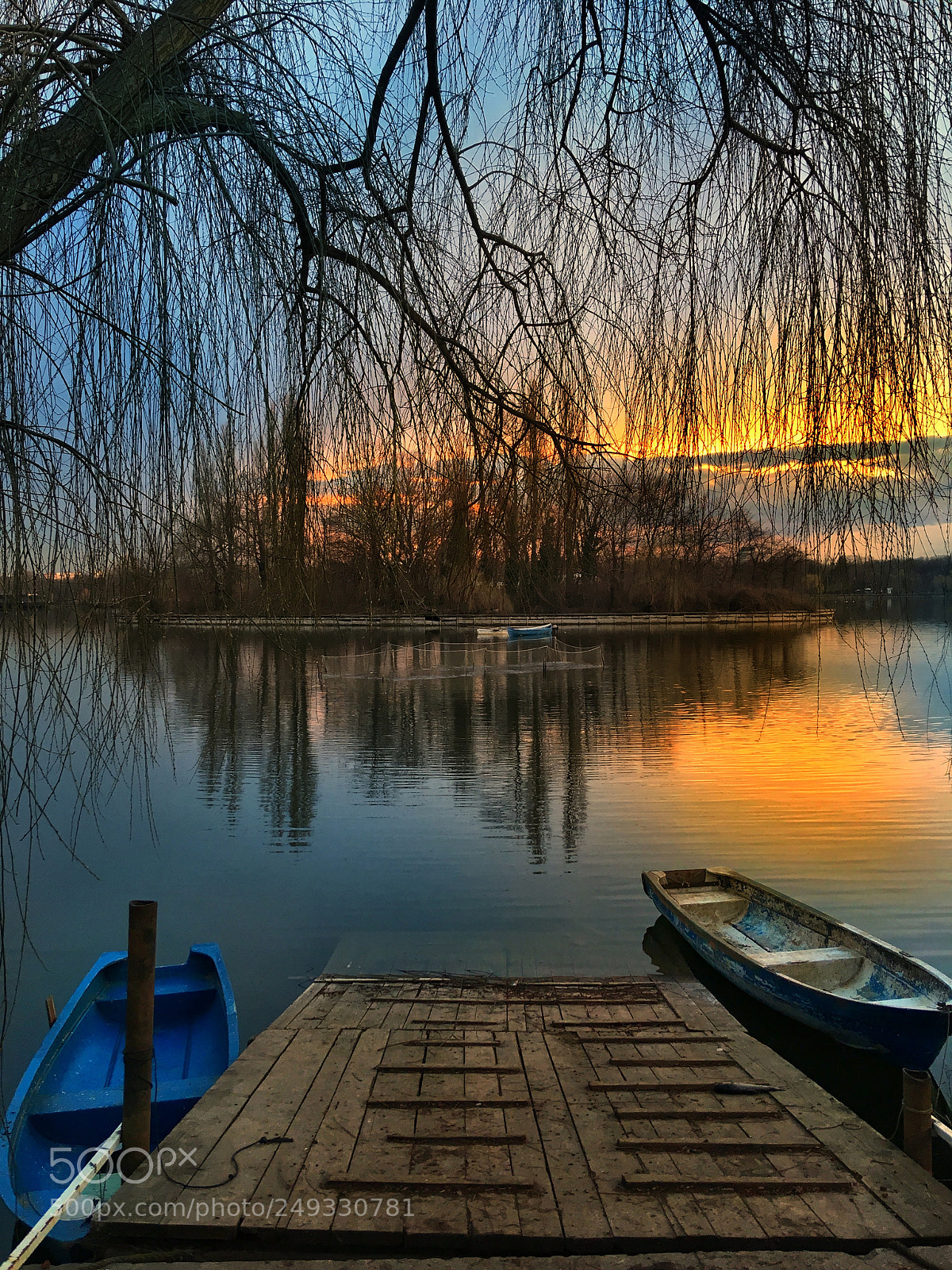 Apple iPhone SE sample photo. Boats against sunset photography