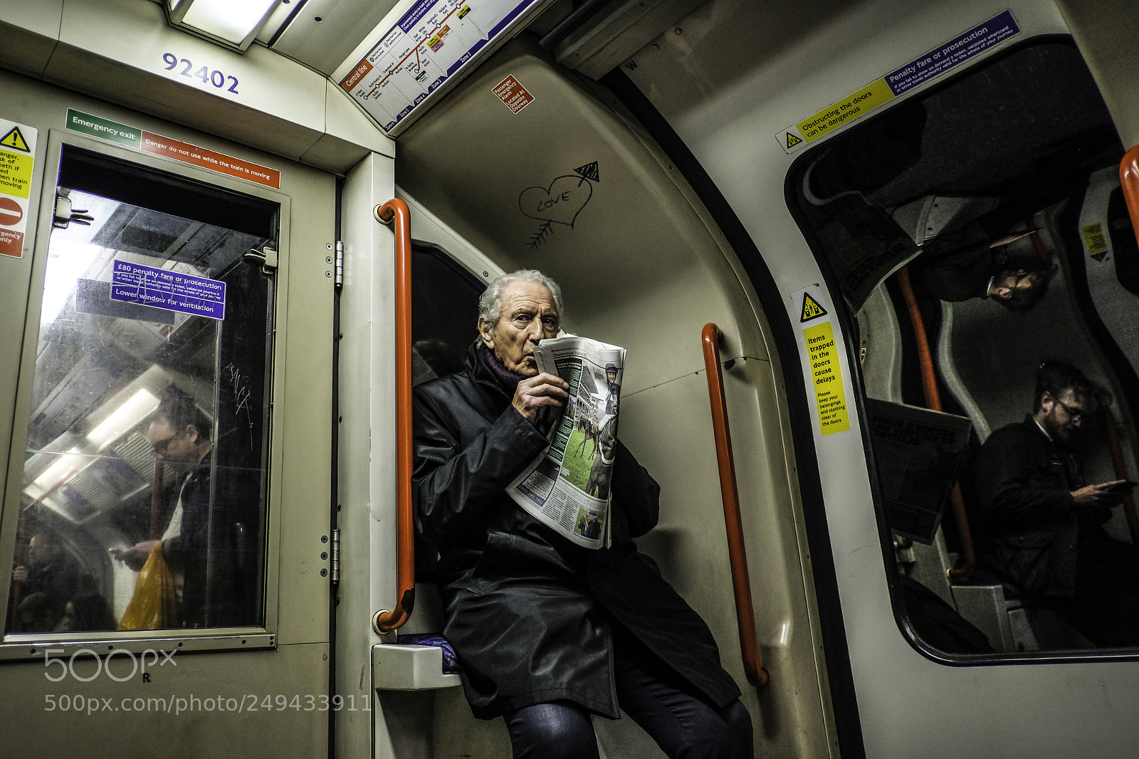Fujifilm X-E3 sample photo. Man reads paper on photography