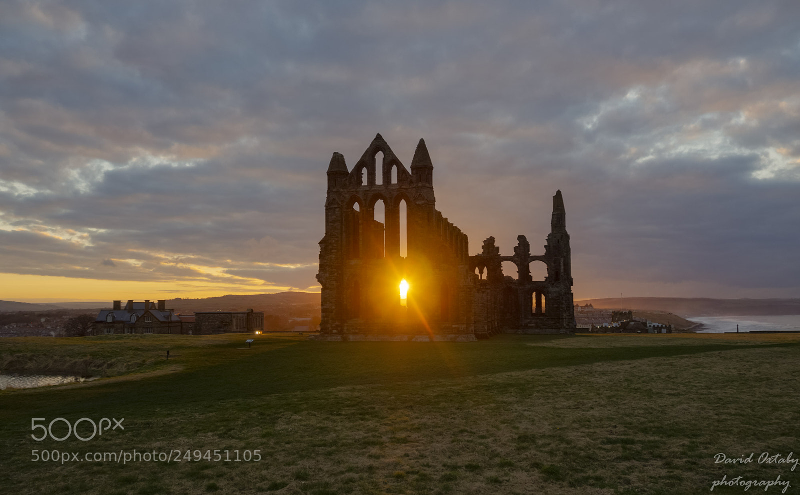 Olympus OM-D E-M10 II sample photo. Sun setting behind whitby photography