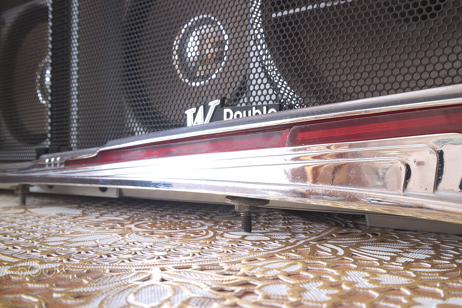 Canon EOS M10 sample photo. Molding on the hood of the car against the background of the tape recorder photography