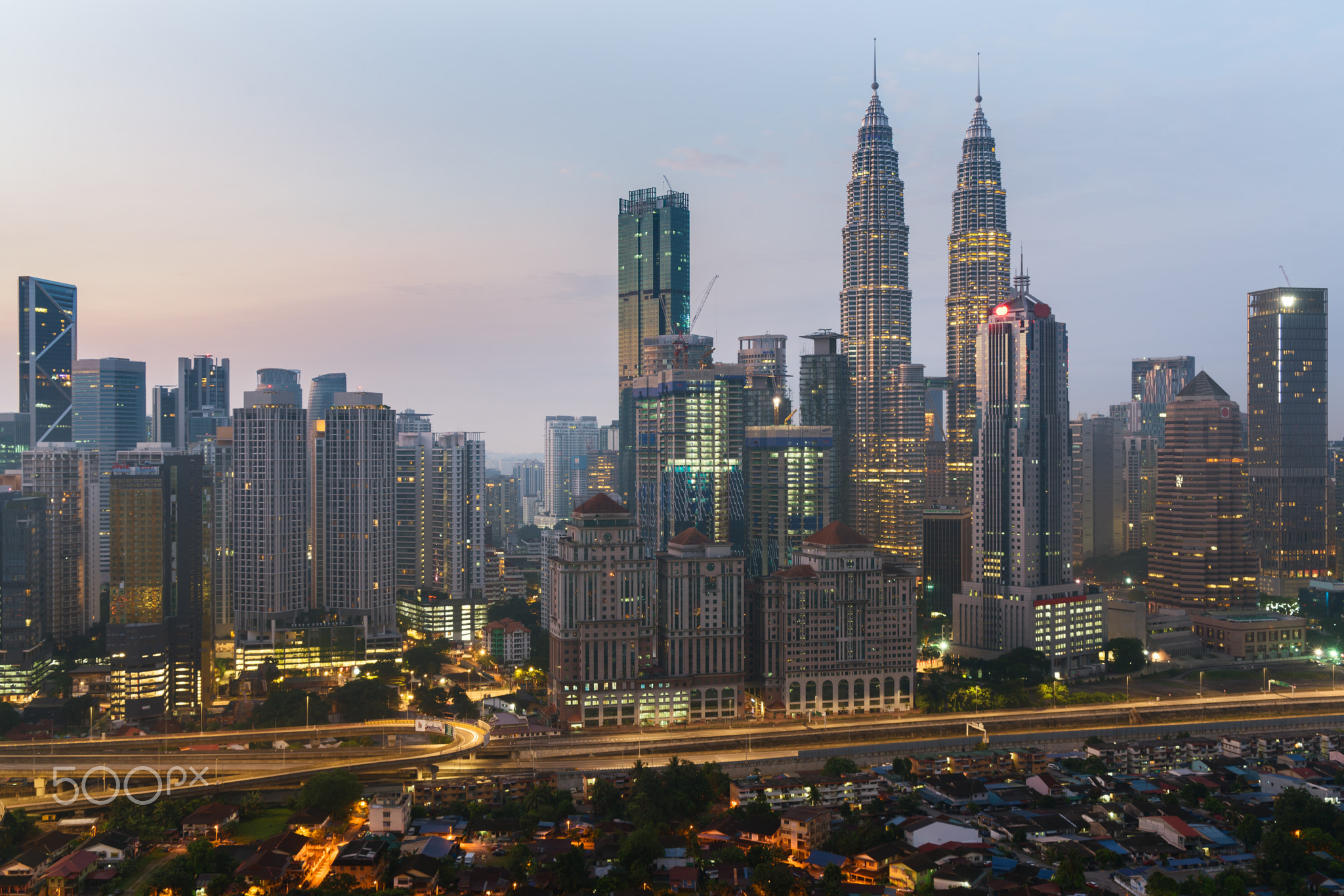 Kuala Lumpur skyline and skyscraper with highway road at night i