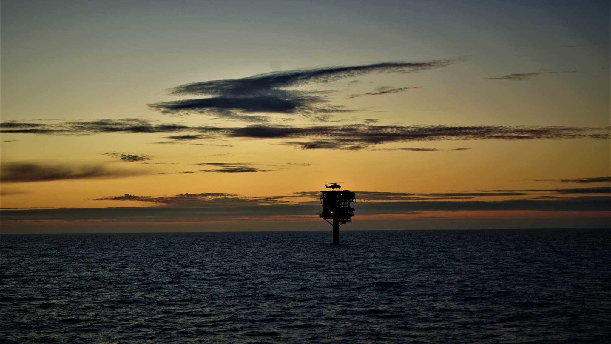 Sony FE 28-70mm F3.5-5.6 OSS sample photo. Sun set over a rig photography