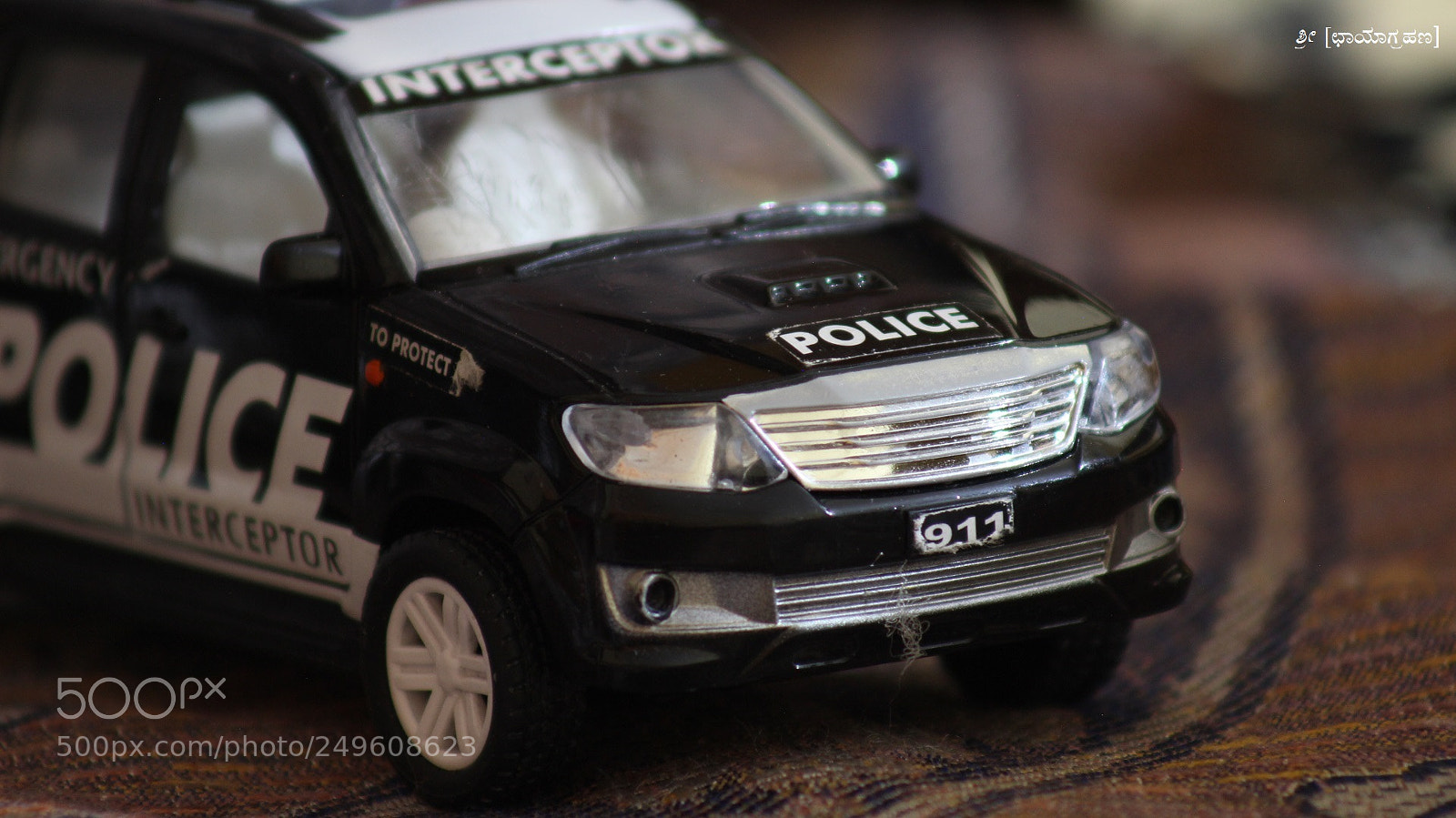 Canon EOS 600D (Rebel EOS T3i / EOS Kiss X5) sample photo. Toy police car, captured! photography