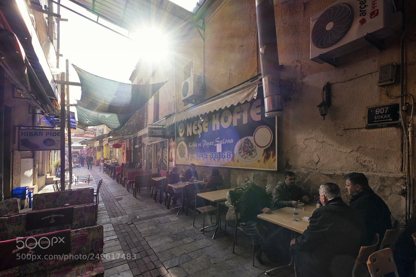 Fujifilm X-T1 sample photo. Sidewalk cafe at sunset photography
