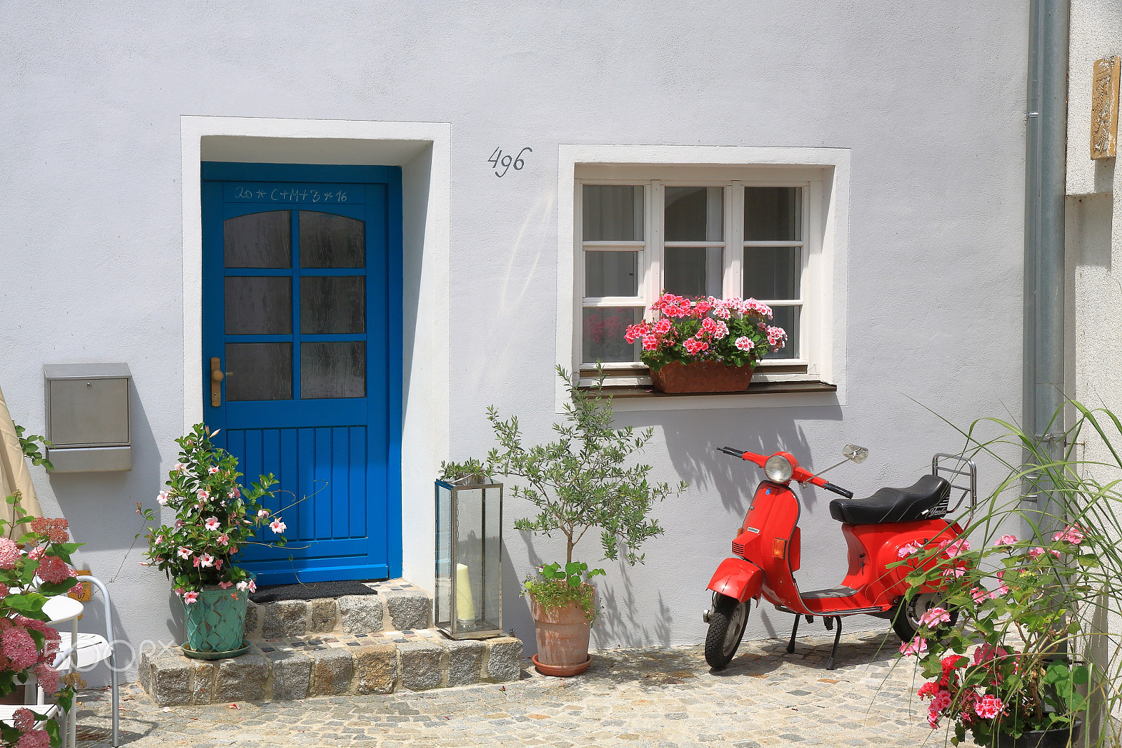Canon EOS 50D + Canon EF-S 15-85mm F3.5-5.6 IS USM sample photo. Blue door and red vespa photography