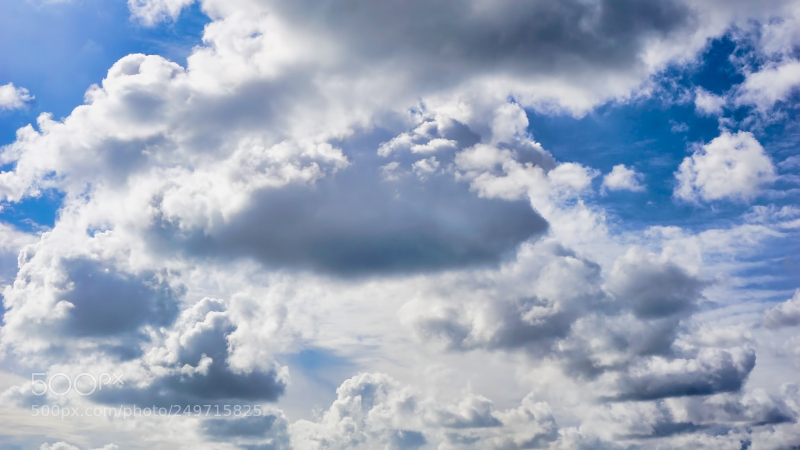 Sony a6000 sample photo. White clouds in blue photography
