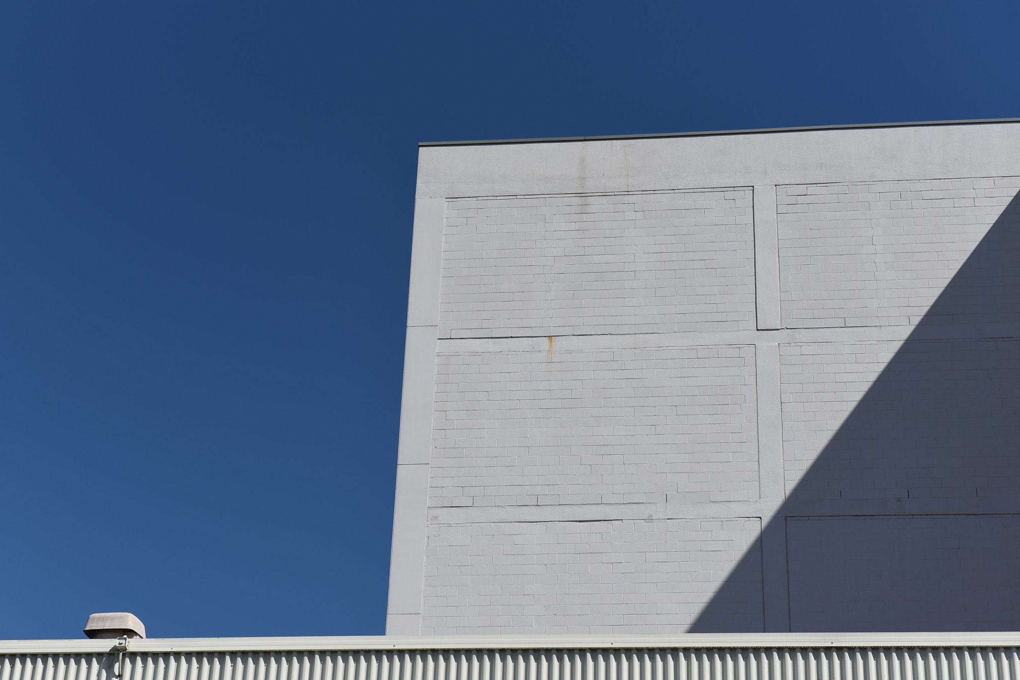Nikon AF-S Nikkor 24-70mm F2.8G ED sample photo. Wall and blue sky... photography