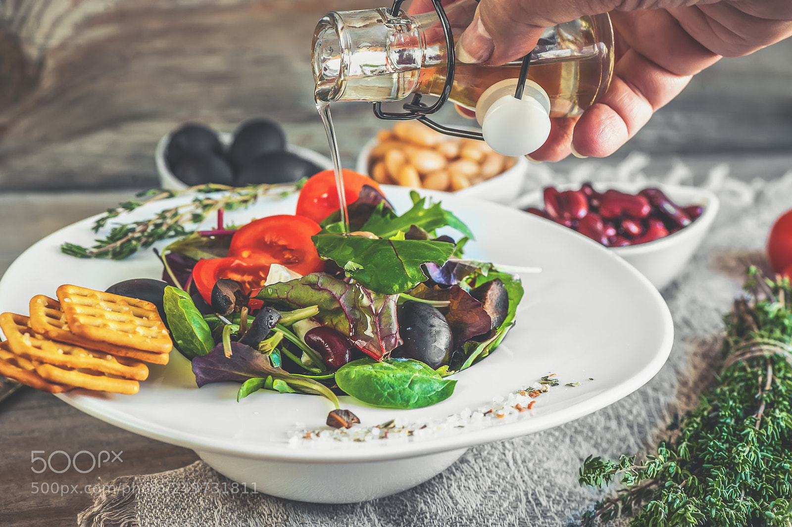 Nikon D700 sample photo. Hand pouring olive oil photography