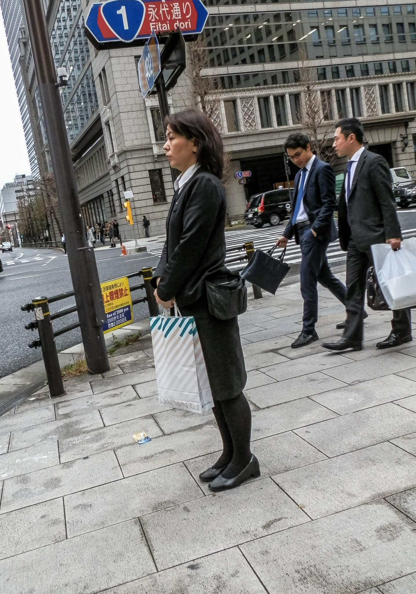 Olympus SZ-10 sample photo. A woman waiting for a signal in the city. photography