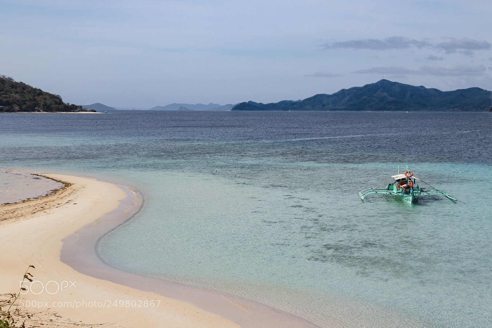 Canon EOS 760D (EOS Rebel T6s / EOS 8000D) sample photo. Boat approaching desert island photography