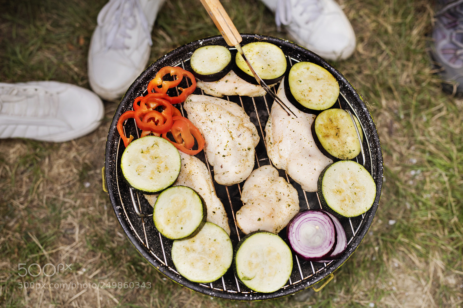 Nikon D5 sample photo. Unrecognizable teenagers cooking vegetables photography