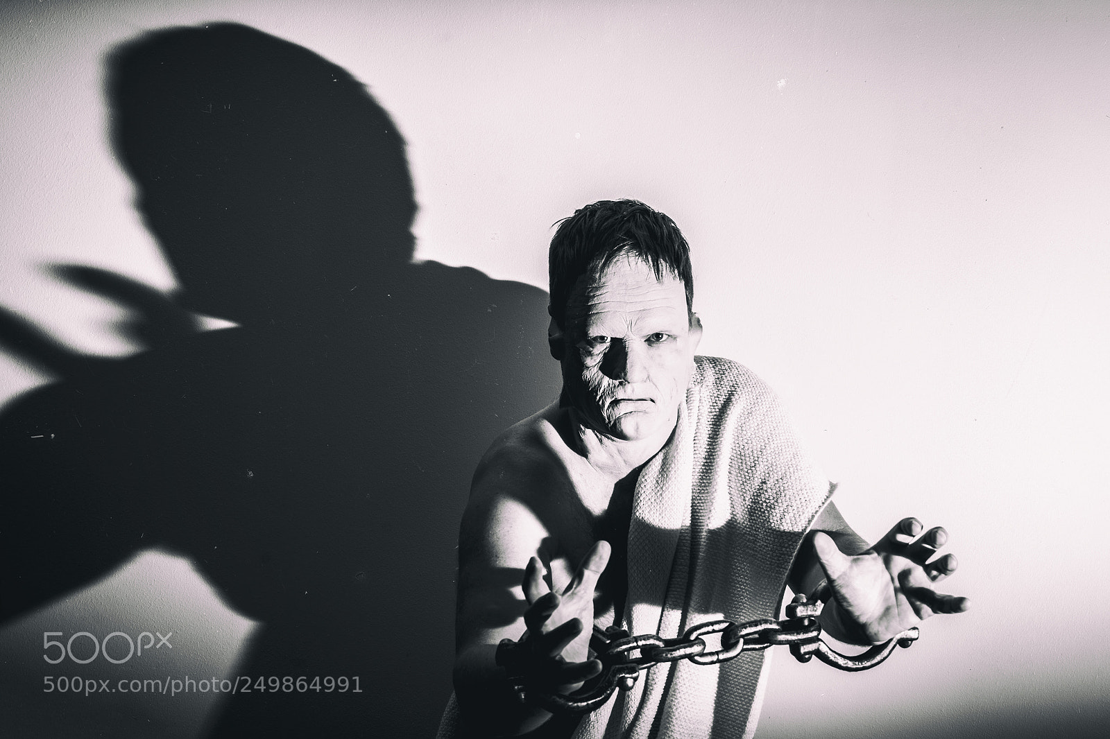 Sony a7 sample photo. Man with chains against photography
