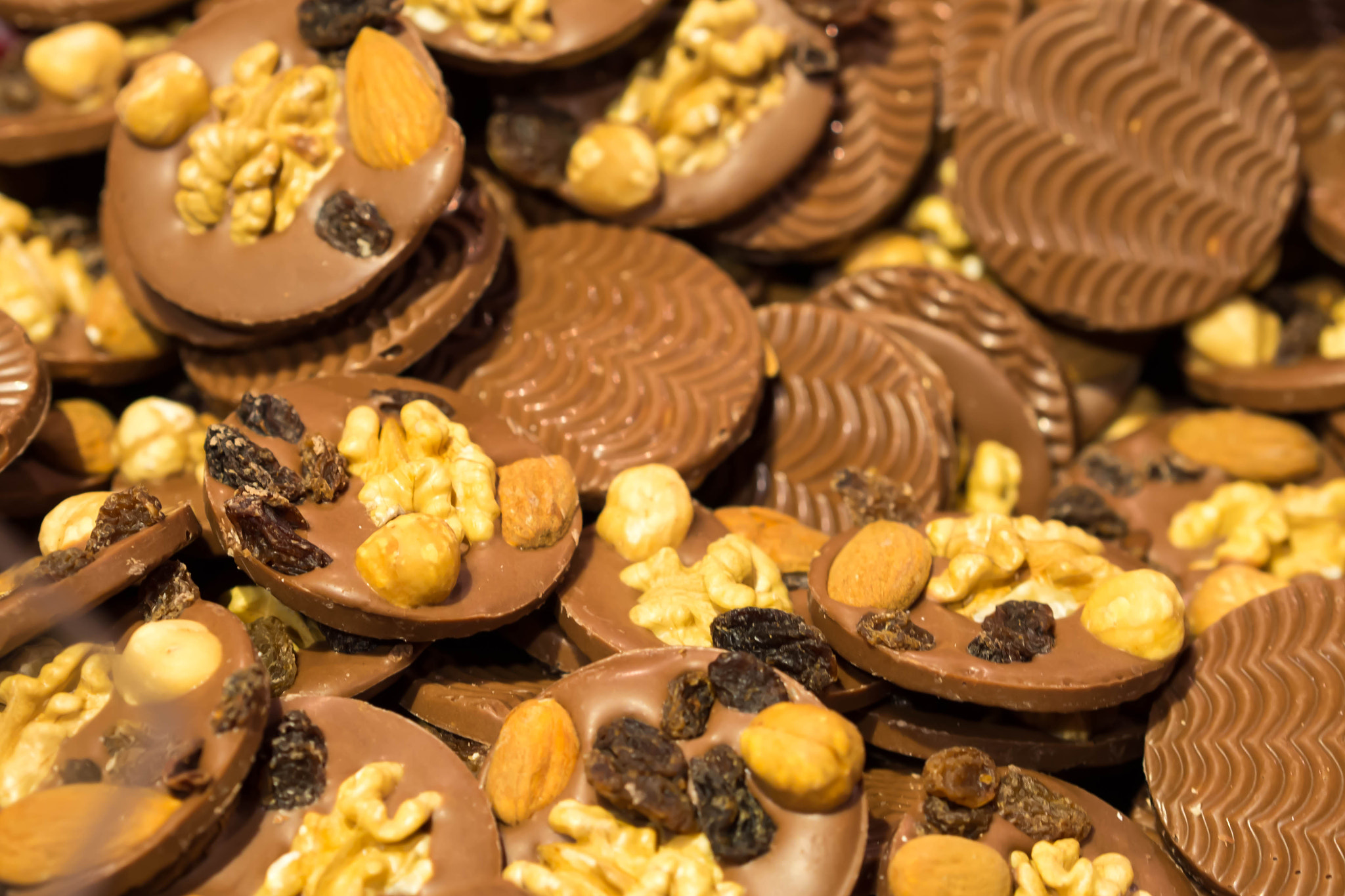 Olympus PEN E-PM2 sample photo. Chocolate with nuts and raisins photography