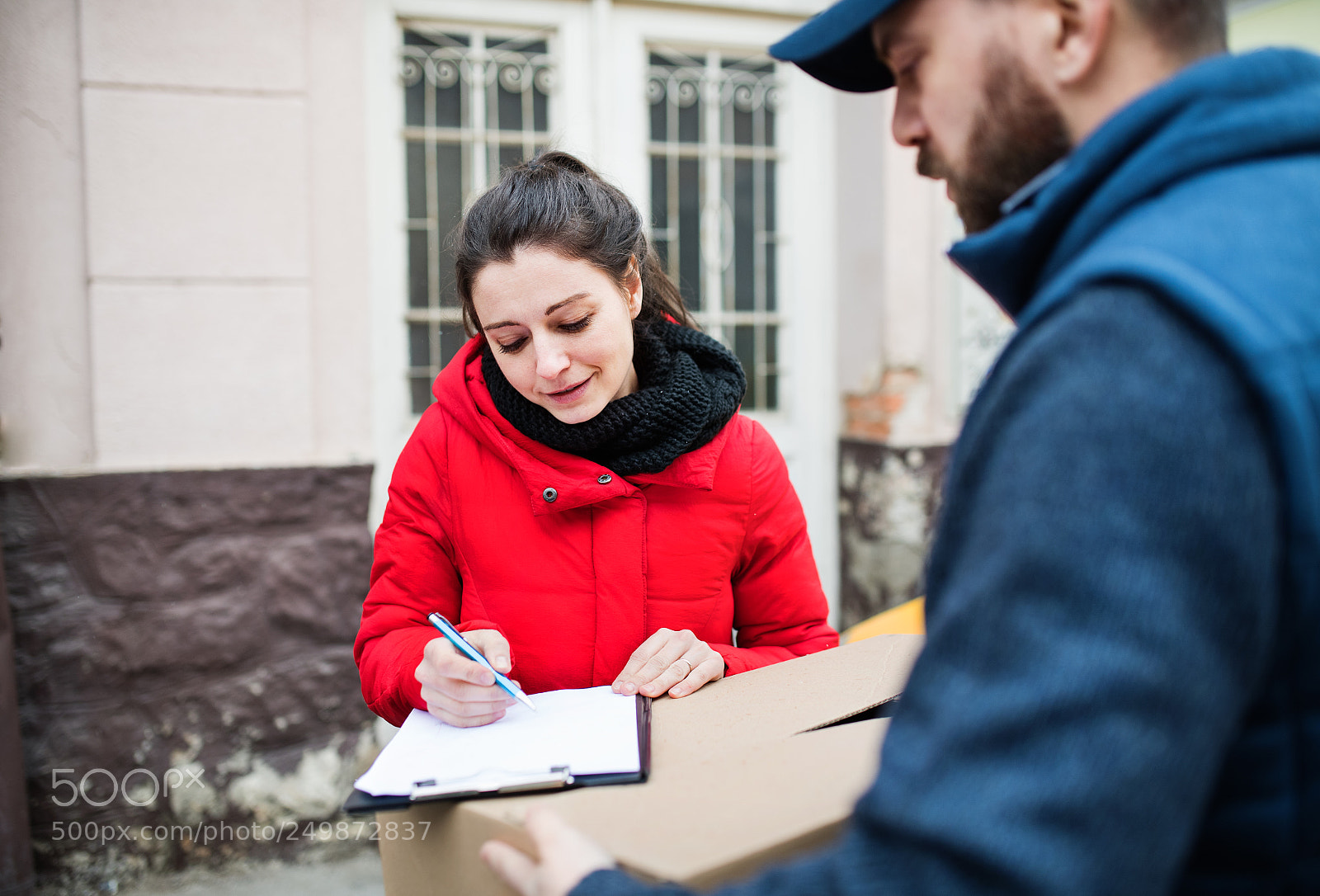Nikon D5 sample photo. Woman receiving parcel from photography