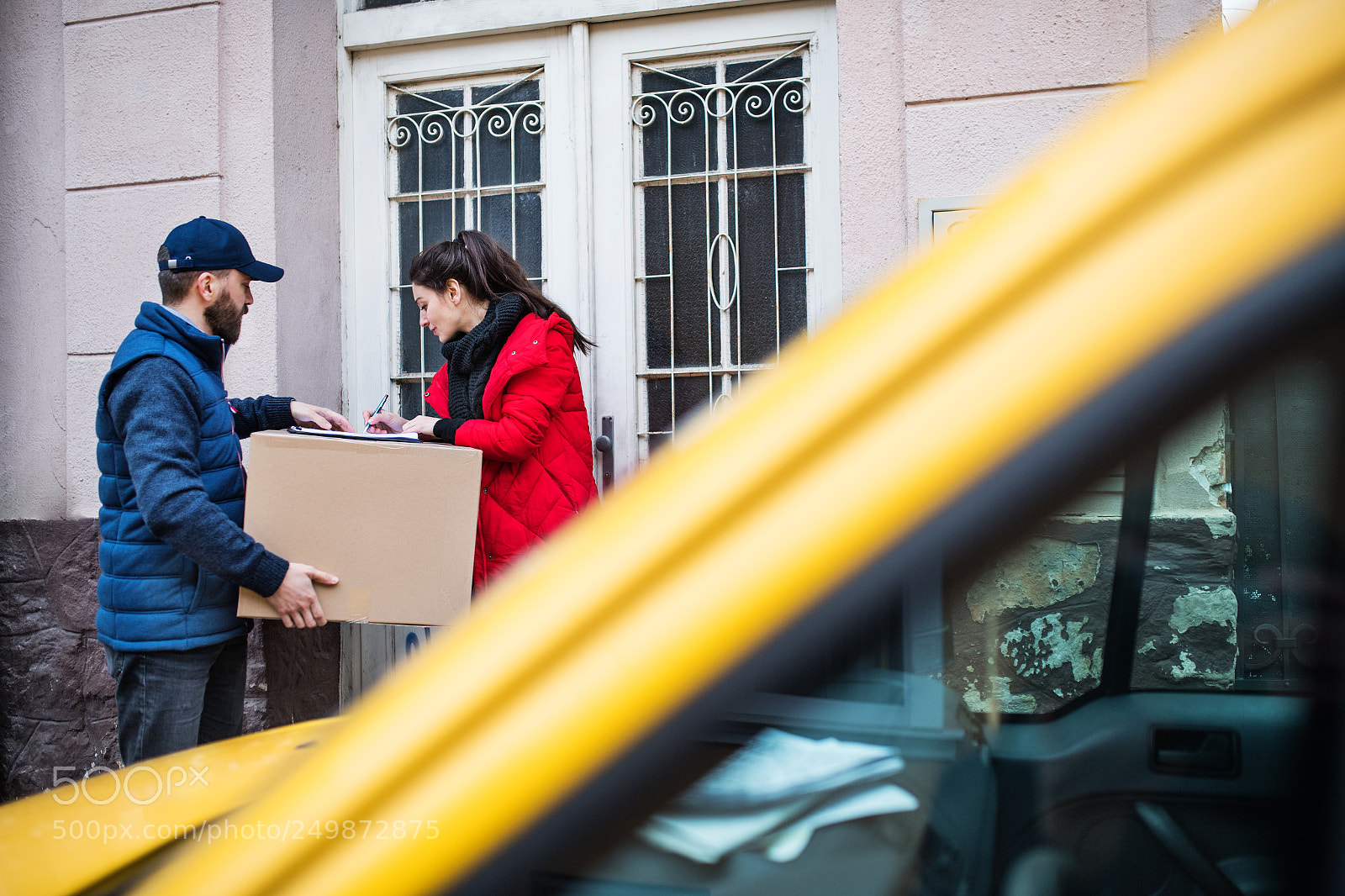 Nikon D5 sample photo. Woman receiving parcel from photography