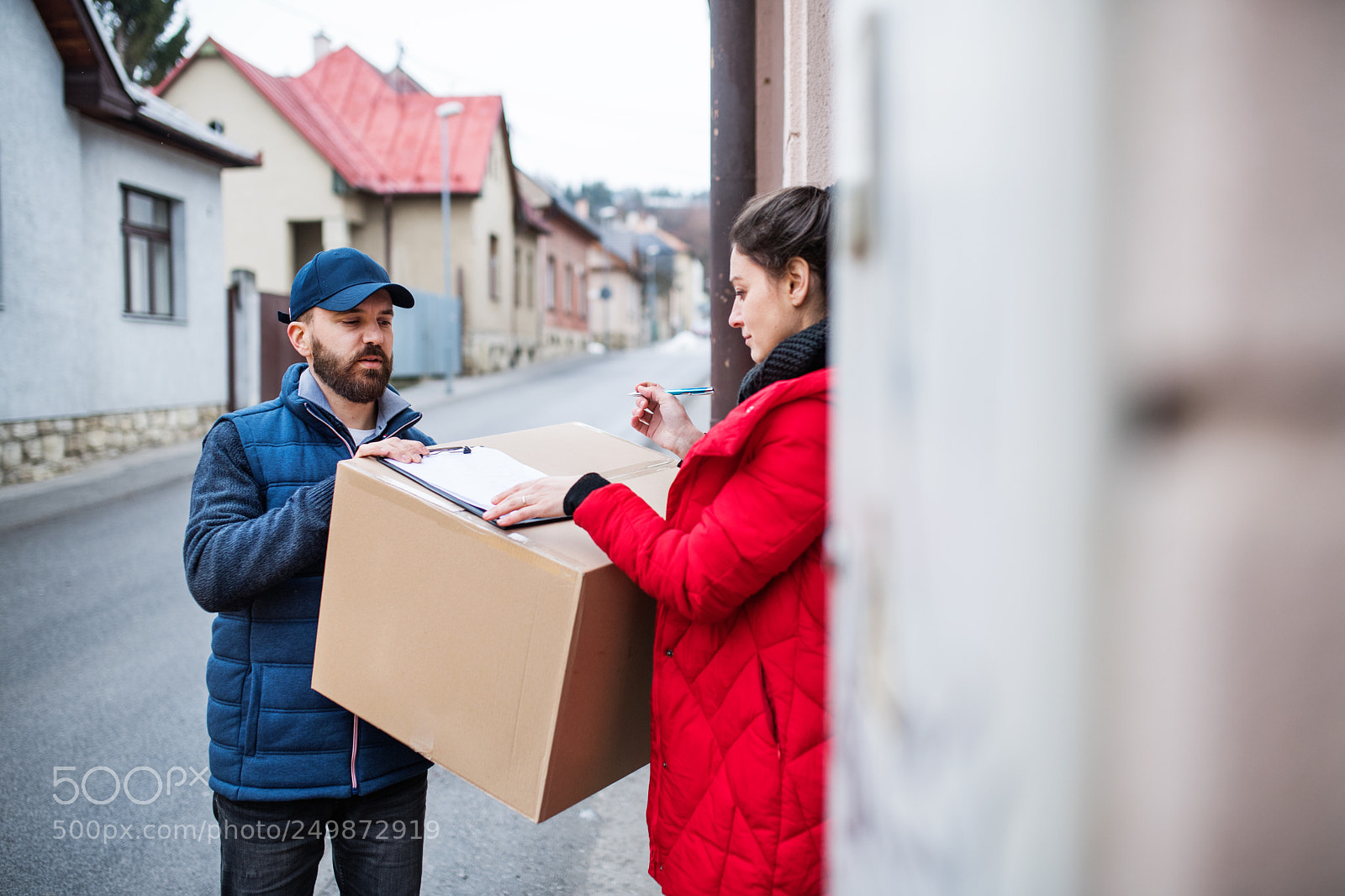 Nikon D5 sample photo. Woman receiving parcel from photography